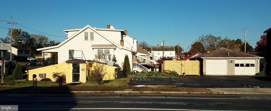 INVESTOR ALERT !!! Mixed Use Property  - Corner Lot   Formally Corsi's Pizza & Charlie's Chinese Restaurant, with 3 Bedroom 2 Bath Home Above. and 2 Car Garage.  Gas Heat . Approximately 9 Parking Spaces; Great Location/ High Visibility/ Lots of Traffic. All Restaurant Equipment Still In Place, Pizza Oven, 2 Walk-in Freezer / Coolers (In Garage), Tables / Booths, Fryers, etc. Included. Future use to be confirmed/ verified by buyer with City of Hagerstown Planning & Zoning (Restaurant Only).  Being Sold Strictly  As - Is. Needs Some Cosmetic Work / Cleaning.