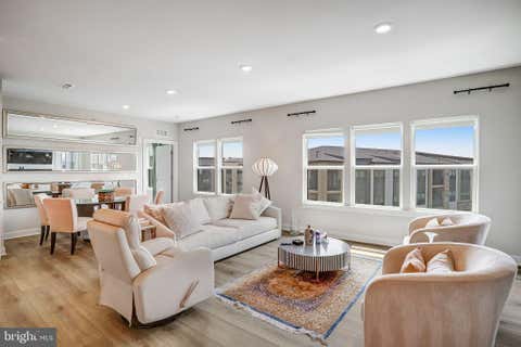 Photo of 12850 Mosaic Park Way #2U, HERNDON, VA 20171 (MLS # VAFX2326920)