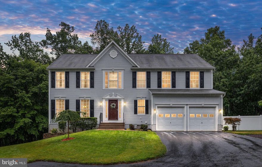 Welcome Home! This beautiful 5-bedroom, 3.5 bath home with finished basement, is in the sought after community of Austin Ridge, and offers wonderful updates and upgrades throughout!  Situated back on a .45-acre lot that backs to trees, this home offers a private setting.  Upon entering the home, you are welcomed with a large open foyer that showcases classic crown molding and stunning hardwood floors.  The hardwood floors flow throughout the whole main level, main staircase, and upstairs hallway!  The living/sitting room is gracious in size and is open and welcoming.    The living/sitting room opens to the dining room that features a picturesque bay window that offers a delightful combination of natural light, views of the outdoors and additional space!   The updated eat-in kitchen provides a well-equipped space for cooking, entertaining, and enjoying meals, while offering stainless steel appliances, granite countertops, pantry, coffee bar area and an island.  The eat-in kitchen opens to the family room and promotes a seamless flow of space while creating a warm and inviting atmosphere.  The family room features a gas fireplace and mantle!  The King size primary ensuite bedroom with its cathedral ceiling, two (2) walk-in closets, linen closet and updated full bathroom offers a luxurious and comfortable living space. The primary bathroom stands out with its contemporary flooring, double vanity, upgraded countertops, custom lighting, deep soaking tub, and separate shower.  All bedrooms have fans and great closet space.  The finished basement is a multi-functional space with a full bathroom, recreation room/2nd family room, 5th bedroom, and a large storage room with built-in shelving.  But wait…there’s more!  You will have access to the backyard from the walk-out basement and main level.  From the basement, an extended stamped concrete patio showcases a hot tub and offers an inviting outdoor space for relaxation, entertainment, and enjoying the outdoors.  From the main level, you will have direct access to a large deck that features steps on both sides of the deck. One set of steps takes you to the stamped concrete patio area while the other set takes you to the fenced-in backyard area!   Conveniently located near a commuter lot, hospital center, I-95, shopping, restaurants, Jeff Rouse Sport Center and more! This home is NOT to be missed!  Move In Ready!  Do Not Miss Out!