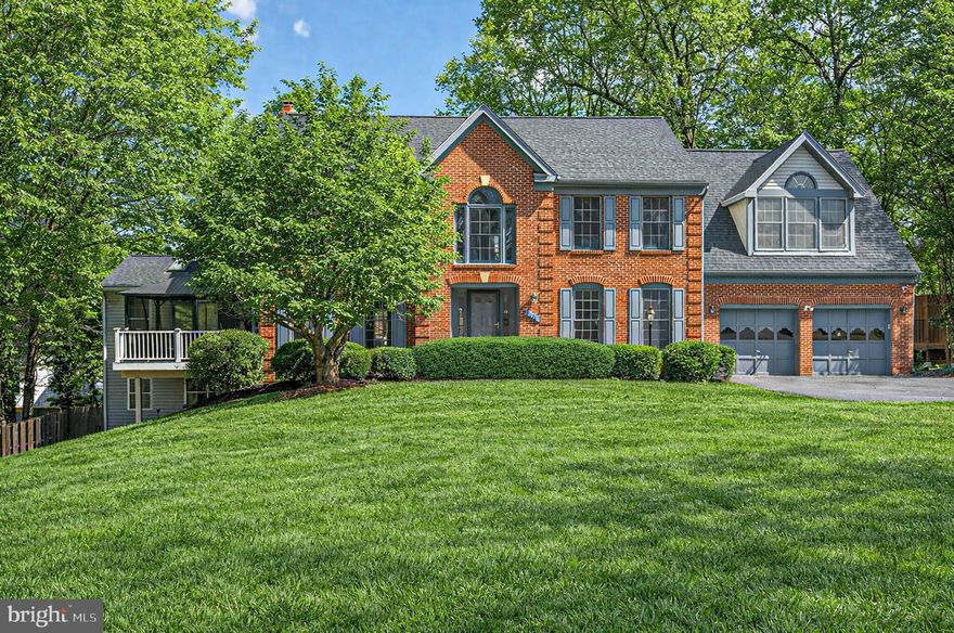 Welcome to 8301 Kings Ridge Court, set on a breathtakingly landscaped and secluded cul-de-sac lot. This stately home features expansive sun-drenched rooms, including formal living, dining and spacious family room, gourmet kitchen, and 6 bedrooms, 4.5 baths, plus a 2-car garage. The kitchen is a chef's dream with top-of-the-line appliances ample cabinet space. A main level primary suite with patio completes the first floor. Upstairs, the sumptuous second primary suite features 2 large walk-in closets, an enormous, spa-like primary bath. Three spacious bedrooms share a guest bath. The large lower level allows for lounging and entertaining with a family room and bedroom plus a full bath. This beautiful home sits on a corner lot with mature trees, extensive plantings, and two large patios.