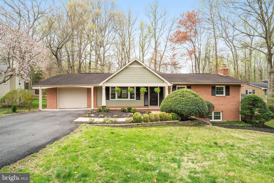 This expanded  home with great curb appeal  is situated in the heart of  Mantua community, located just a block to the Swim and Tennis Club, and 2 blocks to the Fairfax Cross County Trail. The main level family  room addition is this property's  most  attractive feature; providing a spacious and light filled living area with high ceilings, open to the kitchen and overlooking the back yard.  The 0.41 acre level  yard is a haven for many types of birds and is fully fenced with a deck to sit and admire nature and wildlife.  The kitchen has a new cooktop and stainless steel refrigerator, as well as a recent wall oven.  With 4 bedrooms, and 3 full baths, this home has approximately 3200 finished square feet and is very suitable for anyone with limited mobility who might need one level living.  There are 3 bedrooms on the main floor - the primary suite has its own ensuite bathroom, and there is a hall bathroom also with a tub.  The lower level living area and bedroom have gleaming hardwood floors and the very large family room has a fireplace, 4th bedroom, 3rd full bath and a good size laundry /storage room.   1 car front loading garage. Short distance to Inova Fairfax Hospital, Mosaic Center, and great location for commuters; close to many major highways. Vienna and Dunn Loring Metros nearby. Woodson HS pyramid.