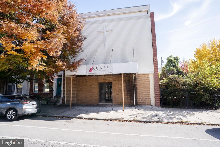 Versatile Opportunity Near Johns Hopkins – Approved for Worship, R-8 Zoned
Located just north of Johns Hopkins and surrounded by a wave of new development, property rehabs, and active investment, this operating church presents a rare and flexible opportunity in a rapidly transforming corridor.
Currently approved for use as a Place of Worship or Educational Facility (Primary and Secondary), the property sits on R-8 zoned land with potential for 4–5 residential dwelling units. Its zoning also opens the door to a wide array of additional uses—subject to zoning board approval—including:
Education, 
Community Center or Cultural Facility,
Vocational or Post-Secondary Educational Facility,
Government Facility or Hospital,
Adult or Child Day-Care Center,
Farmers Market or Social Club,
Art Gallery, Office Space, or Personal Services,
Restaurant or Retail (non-alcoholic)
*Buyer responsible for verifying zoning and uses*
Whether you're an investor, developer, nonprofit, or institution, this site offers unmatched adaptability in a location primed for growth. With proximity to Johns Hopkins and a surrounding landscape of revitalization, the property is ideal for mission-driven expansion, mixed-use concepts, or community-focused ventures.
Unlock the potential—schedule a tour today and explore the possibilities.