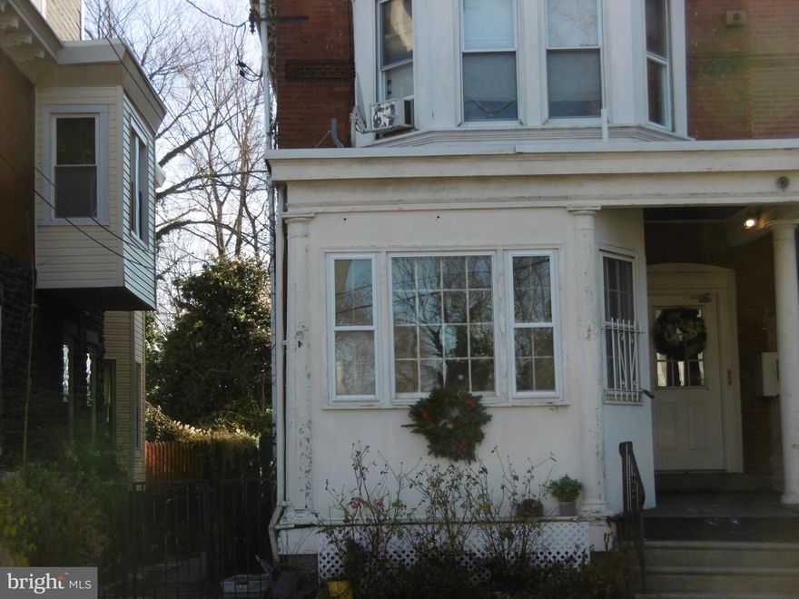 Sun filled First Floor Two Bedroom unit with Off Street Parking.  Hardwood flooring thru-out. Newer refrigerator and gas range, direct access to Rear Fenced Yard.