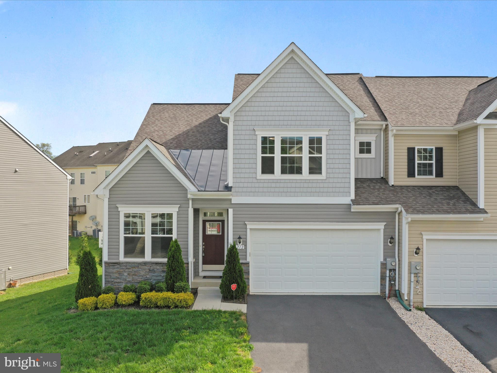 Welcome to 212 Darden Ct W, a meticulously upgraded semi-detached end-unit home located in the highly desirable Martinsburg Station community. Just minutes from I-81, Martinsburg Commons, schools, and WVU Medicine Berkeley Medical Center, this home offers convenience, comfort, and access to amenities like a community swimming pool, tennis courts, walking trails, playgrounds, a fishing pond, and a clubhouse. Offering over 2,000 square feet of thoughtfully designed living space, this 3-bedroom, 2.5-bath home also includes an unfinished basement with 9-foot ceilings and plumbing rough-ins, providing the opportunity to easily add a future bedroom, full bathroom, or expanded living area. The layout is ideal for anyone seeking the ease of main-level living, featuring a full primary suite, laundry room, and essential living spaces all on the first floor. Throughout the home, every upgrade was selected for durability, comfort, and practicality. Granite countertops are installed throughout the kitchen and bathrooms, and the kitchen features soft-close cabinets and drawers to reduce wear and tear over time. Custom cabinets were added to the laundry room to increase storage options, while the full bathrooms were enhanced with tile floors and tub surrounds. Additional thoughtful touches include comfort-height vanities and timer switches on bathroom vents to prevent humidity from building up after showers. The first floor is finished with luxury vinyl plank flooring, offering a beautiful, low-maintenance surface that’s both pet-friendly and stylish. Each room features remote-operated, low-profile ceiling fans with adjustable brightness and light temperature settings. Upstairs, two spacious bedrooms each include custom closet systems for improved storage, and a finished bonus room provides a dedicated home office space—perfect for working from home. The custom deck was designed to capture morning sunlight and provide shade in the evening, an ideal setting for outdoor dining, entertaining, or relaxing with family and friends. 212 Darden Ct W was thoughtfully upgraded with long-term comfort, functionality, and low-maintenance living in mind. Don’t miss the opportunity to call this beautiful and practical home your own—schedule a private tour today!