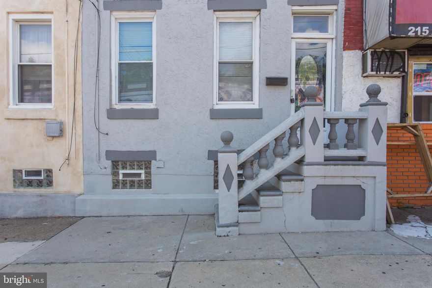 One of the LARGEST and most OPEN straight-through designs available in this price range in Fishtown/Kensington! Gorgeous updates, immaculate condition and sprawling layout! 16' wide design offers plenty of room to spread out with 1318 square feet of living space. Neutral, earthy palate. Leaded-glass entryway, vestibule, fabulous wide-open living room with gleaming refinished hardwoods, recessed lighting, double fans. Formal dining area with decorator chandelier, pass-through with breakfast bar seating. Beautifully updated kitchen with ceramic floors, granite surfaces, maple cabinetry, glass-tile backsplash, stainless appliances, front-loading washer/dryer. Sliders to large fenced patio. Massive owner's suite with triple closets, luxury bath with Travertine and walk-in shower with sleek barn-style glass door. Generous guest rooms, closet space. Full unfinished lower level for abundant storage, new boiler and water heater. Lovely curb appeal and fantastic location with ample parking and instant access to the I-95 corridor. Move right in!