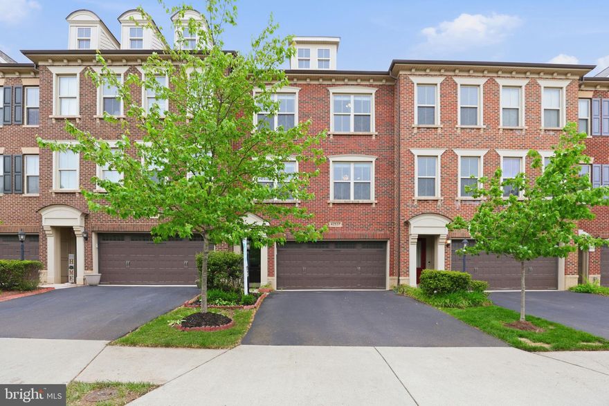 Step into a home where comfort, elegance, and everyday living come together beautifully. Nestled in the heart of Ashburn’s highly sought-after Brambleton community, this stunning Winchester Homes Paxton model with a 4-foot extension invites you to experience a lifestyle you’ve been waiting for.
From the moment you walk in, you’ll feel the warmth of a thoughtfully designed space that truly feels like home. The main level welcomes you with rich hardwood floors and an inviting flow—from the formal living and dining rooms where memories are made, to a private office perfect for quiet moments or working from home. At the heart of it all is the expansive family room, ideal for gathering with loved ones, seamlessly connected to a gourmet kitchen that will inspire your inner chef. Featuring a large center island, elegant cabinetry, granite countertops, stylish backsplash, and soft pendant lighting, this kitchen isn’t just functional—it’s where life happens. Step out onto the spacious deck and imagine morning coffee or evening sunsets in your own private retreat.
Upstairs, the primary suite offers a peaceful escape at the end of the day. Unwind in your spa-like bath with a soaking tub, glass-enclosed shower, dual vanities, and a generous walk-in closet designed to keep everything effortlessly organized. Two additional bedrooms provide comfort and flexibility for family, guests, or creative space, while the conveniently located laundry room makes daily living that much easier.
The lower level extends your living space even further, featuring a cozy recreation room with a fireplace—perfect for movie nights or relaxed weekends. With a full bath and walk-out access to a private fenced patio, it’s an ideal setting for entertaining or simply enjoying quiet outdoor moments.
Living in Brambleton means more than just a beautiful home—it’s a vibrant lifestyle. From scenic trails and parks to community events, shopping, dining, and top-tier amenities, everything you need is right at your fingertips. Plus, with easy access to major highways, Dulles Airport, and the Silver Line Metro, convenience is always within reach.

Unique Features That Set This Home Apart
Unlike many townhomes, this property offers a thoughtfully designed layout with a separate private office, perfect for working from home or quiet study. The main level features not just one, but distinct formal living and dining rooms, creating elegant spaces for entertaining—something rarely found in typical townhomes.
At the heart of the home is a spacious gourmet kitchen that opens seamlessly into a large, inviting family room, ideal for everyday living and hosting gatherings. Step outside to enjoy a generous deck for outdoor dining and relaxation.
The fully finished lower level includes a recreation room with access to a private backyard patio, providing additional space for entertaining or unwinding.
Upstairs, the home features a large primary suite designed for comfort, while all bedrooms boast vaulted ceilings, enhancing the sense of space, light, and architectural charm throughout.
This home truly offers the space and functionality of a single-family home with the convenience of townhome living.

This isn’t just a home—it’s where your next chapter begins.