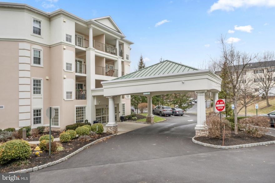 Come see the upgrades! Recently installed quartz countertops, new flooring, freshly painted and move in ready! THIS UNIT INCLUDES A DEEDED UNDERGROUND PARKING SPOT (#1) CLOSE TO THE ELEVATOR AND A STORAGE LOCKER (#1).  Welcome to this sun-lit, 2-bedroom, 2-bathroom condo located in the pet-friendly Windsor at Glen Mills, a vibrant 55+ community. This beautiful home is strategically positioned as a back corner unit, offering unparalleled privacy and an abundance of natural light through its additional windows. Step inside to discover a spacious 1,394 square feet layout with modern amenities tailored for comfortable living. The open-concept kitchen is open to the dining area, perfect for casual dining. Adjacent to this is a generous living room, featuring a slider that opens to a charming side porch—ideal for relaxing and enjoying the serene surroundings. The primary suite is a retreat, boasting a bay window and a walk-in closet. Its ensuite bathroom is equipped with a convenient stall shower. A second bedroom provides ample space for guests or home office needs, while the hall bathroom features a versatile tub/shower combination. Additional highlights include NEW HVAC in 2023, ample closet space, a separate laundry room with included washer and dryer.  Windsor at Glen Mills offers community amenities, including an outdoor pool, a well-equipped exercise room, and inviting common areas such as a billiard room and library, meeting and party rooms. The association plans fun, social events and the monthly fee covers essential services like lawn maintenance, trash removal, and water, allowing you to enjoy a low-maintenance. social lifestyle!