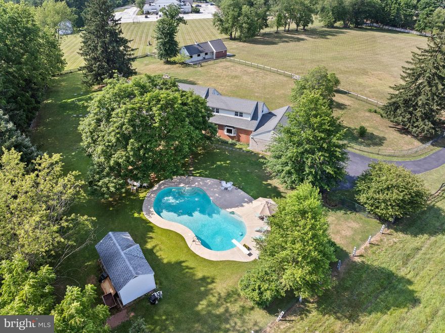 Spacious and solidly built, this Cape Cod home is a blue ribbon property has a very desirable location and many amenities. Set on five peaceful and private acres, the flexible floorplan fits all your needs!  Front porch is perfect place to enjoy sunrises & sunsets, & watching animals in front 3 acre pasture, with two acres around the house fenced with wire to keep smaller pets and tots safe.  On first floor is a large bedroom with four handy closets and a large tile bath. Across the hall is an additional bedroom with ensuite bath. These bedrooms are adjacent to a wood-paneled den on back of house, with thermostat controlled pellet stove insert in fireplace, surrounded by brick wall, and a raised brick hearth makes it cozy in winter.  The sliding glass doors open to the screened porch with skylights and ceiling fan and a truly fabulous  view of pool, pool shed, and fenced yard.  Sunsets and moon rises over the long view of rolling hills at Flintlock Farm that have been enjoyed sitting by the pool are amazing! The den opens to a large living room on the front of the house, with built-in shelves and cabinets on one wall and views out front through floor-to-ceiling windows. Across from the living room, an entry hall opens to a dining room with large picture window, looking out to the front porch and pasture.  The dining room also opens to the kitchen with pantry, butcher block island, and breakfast area with floor-to-ceiling windows.  The kitchen leads to a laundry room with new LG washer and dryer, and the laundry has door to front walkway. Saving the best for last is the front-to-back great room, with wet bar and grill top, back stairs to the second floor,  a door that leads out to the pool, and another door into large 3-car garage with overhead attic. The center entry hall opens to the kitchen, screened porch, powder room, den, and the main stairs to the second floor.  At the top of the stairs, there is a master suite with large closet, leading to a dressing area with full bath and large closet,  with the flow going into a bedroom with closet, and access to back stairs down to the great room, as well as a small attic for storage. At the other end of the house, the hallway has a cedar closet, full bath, two more spacious bedrooms, and access to a large attic. Plaster ceilings and walls, as well as hardwood floors and solid wood doors are found in the majority of the home.  A very rare bonus is the three stall barn, with large hay/tractor storage room, and tack/feed room on ground level, hay loft that holds at least 1.5 tons of hay above, and three acres of lush, fenced-in pasture. Good potential for AirBnB, where guests can bring horses to enjoy miles of trails at Valley Forge, Marsh Creek and Ridley Creek Parks, and many local horse shows, such as Devon and Ludwigs Corner, as well as Radnor Hunt.  Other upgrades include new driveway; septic system designed for six bedroom home; new well pump, pressure tank, and line to house; rebuilt chimney for family room fireplace with thermostat-controlled pellet stove insert, new oil furnace as back up to new heat pump, and spray-foam insulation in attics and basement crawl space walls make this home energy efficient.  Pool upgrades include new Hayward D.E. filter, variable speed pump, pipes and valves, and a Dolphin self-cleaning vacuum.  Minutes from this desirable location on Valley Forge Mountain is the R-5 train station in Paoli, restaurants and shops in Phoenixville, public golf courses, King of Prussia Mall, and the Main Line.  Easy access to Philadelphia and the airport, as well as ramps to PA Turnpike at Valley Forge and Great Valley CC.  Walk to YMCA and Schuylkill Elem. in awardwinning Phoenixville school district.  Convenient to it all, but hidden from the hustle and bustle of daily life is truly what makes “Hidden Hillview” special and valuable.  please don't enter the driveway without an appointment.