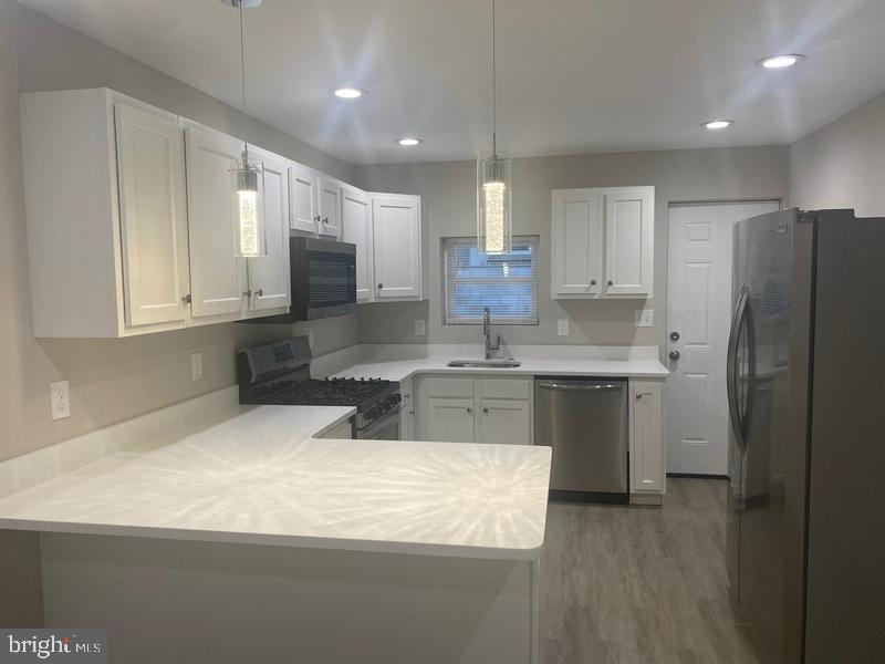 Turn-Key Opportunity Near Patterson Park – Perfect for First-Time Buyers or Investors! Looking for a stylish home or a ready-to-go rental? This BEAUTIFULLY RENOVATED 2-BR, 2 full and 2 half-bath rowhome near Johns Hopkins and just steps from Patterson Park. Checks all the boxes. Minutes from Downtown Baltimore, the Inner Harbor, and Fells Point, this location offers incredible access to everything the city has to offer. Inside, you'll find MODERN WITH CHARM, durable flooring throughout and a thoughtfully designed layout featuring a GOURMET KITCHEN with stainless steel appliances, quartz countertops, a 5-burner gas stove, and a dishwasher. EACH BEDROOM INCLUDES ITS OWN PRIVATE FULL BATH, and with two additional half baths, the layout is ideal for both comfortable living and future tenants. Additional perks include central air conditioning, ceiling fans, in-unit washer/dryer, and rare OFF-STREET PARKING in the rear. Whether you're a first-time buyer looking for a low-maintenance home or an investor seeking a turn-key rental in a high-demand area—this property is READY TO GO. Don’t miss your chance to tour!