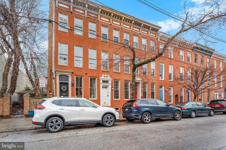 L0CATION, LOCATION, LOCATION! Newly, updated and "WIDE" Baltimore Brick Rowhome.  This beauty is ready for new Owners.  4-Story.  3+ Bedrooms, 3.5 Bathrooms, finished lower level and PARKING.   The fenced yard space is a BONUS and is perfect for outdoor Grill and your Pets will enjoy 
the outdoor space as well.  Located in one of Baltimore's most desired Riverside/Federal Hill Community.  PRIME location with many lovely parks only steps away.  This home is a perfect blend of historic charm and modern updates.  New and bright Kitchen with beautiful counters and plenty of cabinets.  Spacious dining area opens to the Kitchen and half bath on the main level.  Very cool decorative Fireplaces and lovely  hardwoods throughout.  The 3-story Bannister is gorgeous and will WOW you at the front as you enter into the vestibule. Updated bathrooms on the main, second and third levels.  Fabulous Primary Suite on the 3rd level with large open space (perfect area for a Wet bar and additional seating for guests).  And,  Sliding doors that opens to a private deck and amazing City views.  PERFECT home for entertaining.  Your guests will love hanging out and enjoying the Fun Firework displays.  Cozy lower level space with beautiful exposed brick, new flooring and steps.  LL is ideal space for guests, 4th Bedroom, Home Office or Gym, Library or Den.  This GEM is a rare find in a PRIME location. Riverside Ave is a quiet, tree-lined (one-way) street.  Only steps away to both Riverside Park & Federal Hill Park.  Easy access to Latrobe Park, as well as, Fort McHenry National Monument Park with lots of  history and beautiful trails along the Patapsco River.  Enjoy many local restaurants, shops, museums, health clubs, Concert Venues, Camden Yards, M&T Bank Stadium, I-95 and more.  Schedule a private Tour today and make this Home your Home!