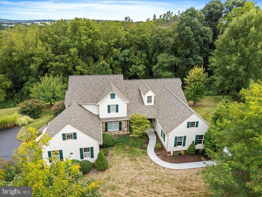 In beautiful Summerfield at Elverson, this 4 bedroom, 3 bath ONE FLOOR carriage home is the floor plan many love for its generous bedroom sizes, the laundry off the hallway (not in the kitchen) and the ceilings which are vaulted for maximum light and airiness. The eat-in kitchen is complete with white cabinets and Corian counters with a table overlooking an inviting front porch.  A vaulted dining and living room, with hardwood floors, exit through patio doors to a raised awning-covered deck.  The master suite  includes patio doors to the deck which overlooks trees and woods.  Privacy in the back abounds.  Two guest bedrooms and a laundry complete the first floor.  The lower level is expansive with a 4th bedroom, full bath, family room, office and storage galore.  Patio doors from the family room lead to a private lower level patio. This one floor home is heated and cooled with a geothermal system.  Stoltzfus built, the basement walls are constructed of a precast wall system called Superior Walls.  Lawn care and snow removal (to your garage door) are taken care of for only $900/year.  Join others who love quiet, safe and friendly living in pedestrian-friendly  Summerfield at Elverson in northwestern Chester County, Elverson.  It truly is the best square mile!