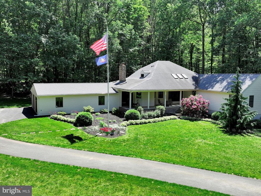 **Secluded Country Estate on Over 10 Private Acres**

Tucked away off a quiet country road and nestled deep along a private driveway, this beautifully maintained 5-bedroom, 4-bath estate offers over 10 acres of unmatched privacy, tranquility, and modern comfort. Whether you're seeking a peaceful retreat or a place to entertain, this property delivers both with elegance and charm.
   A welcoming covered front porch with skylights invites you into a light-filled, open-concept interior. The spacious great room features a cozy fireplace and opens seamlessly to a new 11x54-foot rear deck—ideal for gatherings or simply enjoying the surrounding natural beauty.
   Sunlight pours into the formal living room through large windows, creating a bright and inviting ambiance throughout. The updated kitchen is a chef’s delight, showcasing granite countertops, quality appliances, and a functional layout that flows effortlessly into the dining area and a versatile office or flex space.
   The main level offers a luxurious primary suite complete with a generous walk-in closet and a fully upgraded en-suite bath. A second oversized bedroom and a fully renovated bathroom provide additional comfort and convenience on the main floor. Main floor also features, workshop area off the garage and a renovated laundry room.
   Upstairs, two generously sized bedrooms and a third full bath offer flexible living arrangements for family or guests. The home features new hardwood flooring and fresh paint throughout, offering a turnkey living experience.
   The fully finished lower level is ideal for multigenerational living or extended stays, featuring a private entrance, full kitchen, living area, bedroom, and full bathroom—perfect as an in-law suite.
   Additional features include a newly top-coated private driveway, a 50-year architectural shingle roof installed in 2024, and a back-up generator. Outdoor amenities abound: a 12x20 greenhouse with automated roof vents, an 8x10 garden shed, a 9x10 chicken coop, and two expansive 30x30 carports. A 25x40 attached garage adds further versatility and storage.
   The grounds include eight mature fruit trees—apple, pear, and peach—enhancing the property's self-sustaining appeal and rural charm.
   If you’ve been searching for a private, move-in-ready sanctuary that combines country living with thoughtful upgrades, look no further. This hidden gem is peaceful, private, and ready to welcome you home.