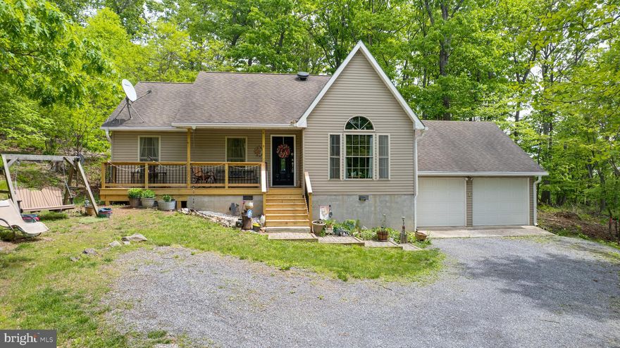 Discover the perfect blend of comfort and nature in this well‑maintained ranch home nestled on just over two acres in the sought‑after Sleepy Hollow neighborhood. With three bedrooms, two bathrooms, and a roomy two‑car garage, this property provides ample space for modern living—all set against a peaceful wooded backdrop that invites deer and turkeys right to your backyard!

Recent improvements include the addition of Gutter Guards for easy maintenance, ensuring your home stays protected year‑round. As part of the Sleepy Hollow community, you’ll also enjoy access to a beautiful lake with a sandy beach, a shaded pavilion, and a baseball field—ideal for leisurely weekends and gathering with friends and neighbors.

For outdoor lovers, this location is unbeatable. It’s just a half‑mile from the Devil’s Nose hiking trails and directly across from the expansive Sleepy Creek Wildlife Management Area, where over 22,000 acres of protected land await your exploration.

Whether you’re seeking a tranquil retreat or a base for your adventurous lifestyle, this home delivers it all. Don’t miss the opportunity to make it yours—schedule your private showing today!!