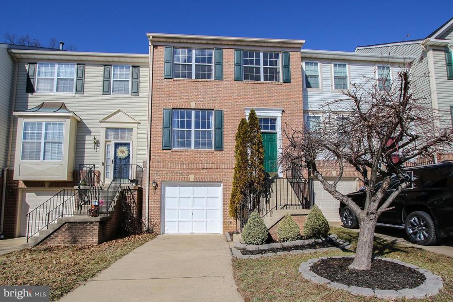 Amazing Price for this Stunning meticulously maintained home with beautiful contemporary accents throughout! Updated kitchen with stainless steel appliances, granite counters and backsplash. Gorgeous Updated Master Bathroom with dual  sinks and large walk-in shower with seat. Basement Family Room with Gas Fireplace and Walkout to yard.  Expansive Deck with fenced yard.Backs to woods.