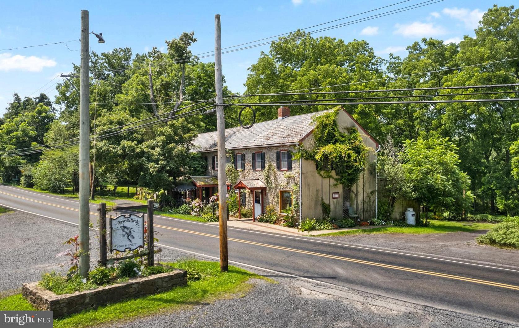 Rare Investment Opportunity! Historic Bucks County Tavern on 8+ Acres - 2 Parcels - R Liquor License - Business Equipment Included - Outdoor Deck/Dining Expansion Plans - Ample Parking! Built in 1710 and operating as a tavern since 1750, Ravens Nest is a beloved local gathering place well known for its weekly live music. There are endless details and charm that accompany a building of this age, including exposed stone, a stone fireplace in the dining room of the tavern, vintage wrap around wood bar, hardwood flooring and deep windowsills. This turnkey business is ready for new ownership and will transfer with stainless kitchen appliances to include a 60" gas range/griddle/broiler/oven, stainless prep areas, bain marie, refrigerators, freezers, coolers and bar equipment to include chiller, fryer, pizza oven, ice machine, griddle and more. The second floor contains a 3 bedroom living unit with beautiful wide plank flooring and a stone fireplace with woodstove insert. Outdoor structures include an art studio with electric, deck, gazebo and additional storage. Plans to expand from the bay window area to a deck for outdoor dining could spill over into the back yard where additional outdoor dining with family pets and yard games could be added. The grounds contain mature trees and plantings which have been lovingly cultivated by the current owners. In close proximity to the D&L Trail, Lake Nockamixon State Park and Lake Towhee Park, there are endless opportunities to draw in outdoor enthusiasts. The second parcel is across Old Bethlehem Road where there is ample parking and/or potential for development. The possibilities are endless! We look forward to showing you this property at one of our open houses, or call to schedule a private tour at your convenience!