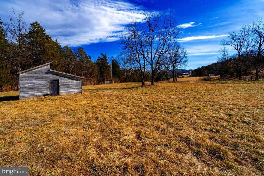 Seller Financing Available! Welcome to the Homestead at Promise View Farm — a place where history, nature, and possibility come together. Nearly 9 acres of rolling Page Valley countryside invite you to create the life you have been dreaming of, whether that is a forever home, a cozy country retreat, a working homestead, or a charming short-term rental to share with others. Here you will find living water all around you — Hawksclaw Creek, a natural spring, and a drilled well — along with a historic stacked limestone spring house that has stood since the early 1800s, reminding you of the generations that came before. The land is already prepared for your vision, with electricity on site, a 3-bedroom septic certification letter, and a VDOT-approved entrance. Three versatile farm buildings add even more potential.  With no HOA, very low real estate taxes, and seller financing with as little as 10% down, it has never been easier to turn your dream into reality. And when it is time for adventure, you are just minutes from two public boat landings on the Shenandoah River. This is more than just a property — it is a chance to build your story in a place that already feels like home.