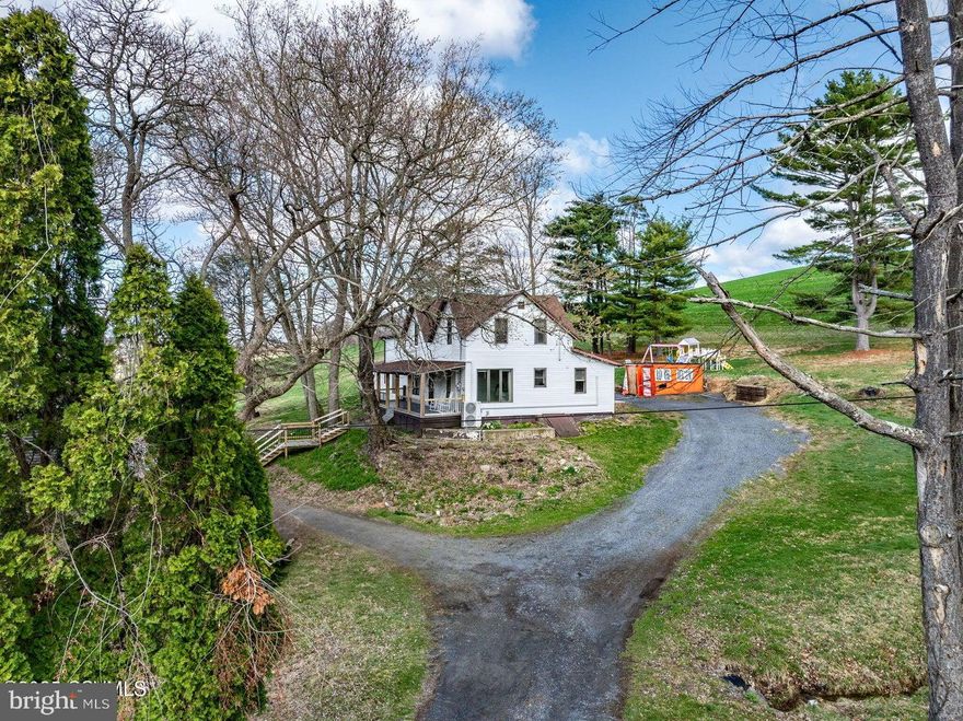 Country Living - sprawling 2-story situated on 11.25 acres with small stream on a partially wooded lot. Recent updates include siding, kitchen with quartz countertops, new carpeting, LVT flooring, 8-head mini split system, primary bath, shiplap accents, 1st floor bedroom, sunroom, and woodstove. Summer nights on the covered front porch or entertaining on the private patio. Open living and family room with floor to ceiling windows will accommodate large family gatherings. First-floor laundry with half bath. Open shed for your lawn equipment and toys, plus a 16' x 22' two-story multipurpose building. Conveniently located between Danville and Elysburg.