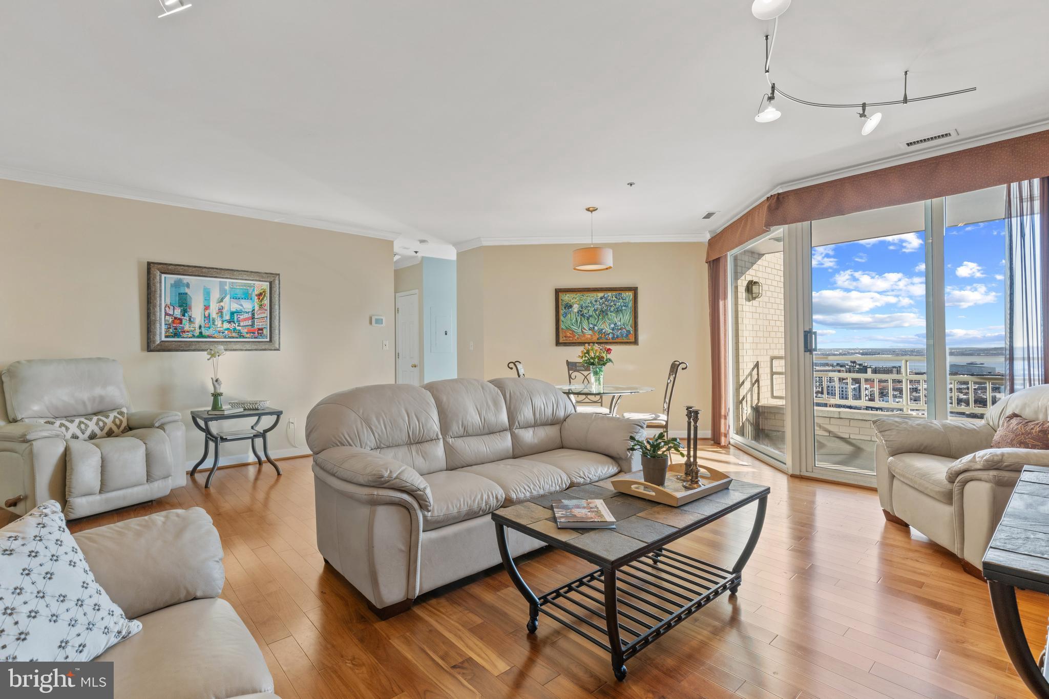 Amazing Baltimore Harbor views and sophisticated urban living - nothing surpasses this two-bedroom, two-full-bath condominium with wood flooring, an eat-in kitchen, an ensuite primary bedroom, two balconies, and a spacious open floor plan well suited to entertaining and day-to-day living. Overlooking the Harborview Marina, the cruise ship terminal, the outer harbor, and the Baltimore Peninsula, you have a front-row seat to Port of Baltimore arrivals and departures and the Key Bridge rebuild. These views are your personal window on the world of beautiful sunrises, magical lights, fireworks, reflected sunsets and the iconic Domino Sugars sign! Whether you are looking for daily ease-of-living or a sophisticated venue for hosting friends and family, you will find your match in Unit 2004. Wood floors enhance the open floor plan and oversized windows in the entertainment space. The gourmet kitchen opens to a spacious, sunny balcony for dining, and easy access to plants and herb gardens. The owners' en-suite with whirlpool tub, and separate shower adds a note of luxury and relaxation, and the walk in closet affords ample closet space for your dressing convenience. Located on the downtown promenade, with easy access to Federal Hill, Harborplace, the water taxi, pubs, eateries, the Orioles' and Ravens' Stadiums, the Hippodrome, farmers' markets, concerts...the list goes on. And The Harborview Towers' amenities that rival those of top hotels include: an indoor pool and an outdoor pool, party rooms and guest suites, and a health center with ellipticals, cardio equipment, and weight work options. A full-time, on-sight management company, 24/7 concierge desk and 24/7 security on the Harborview community property and underground garage enhances each resident's experience. Come for the views - stay for the lifestyle!