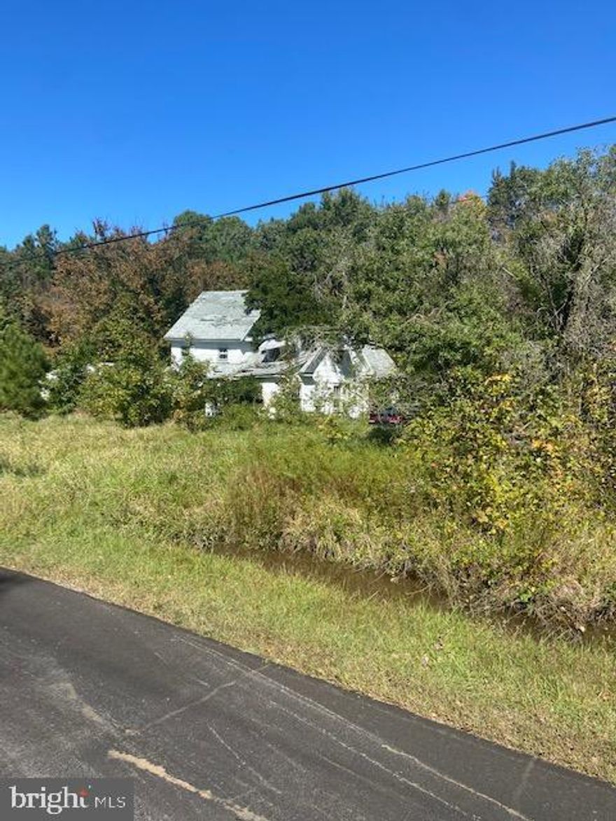 Beautiful quiet area. Over 3 acres of land. House and trailer as is. Great area to hunt!