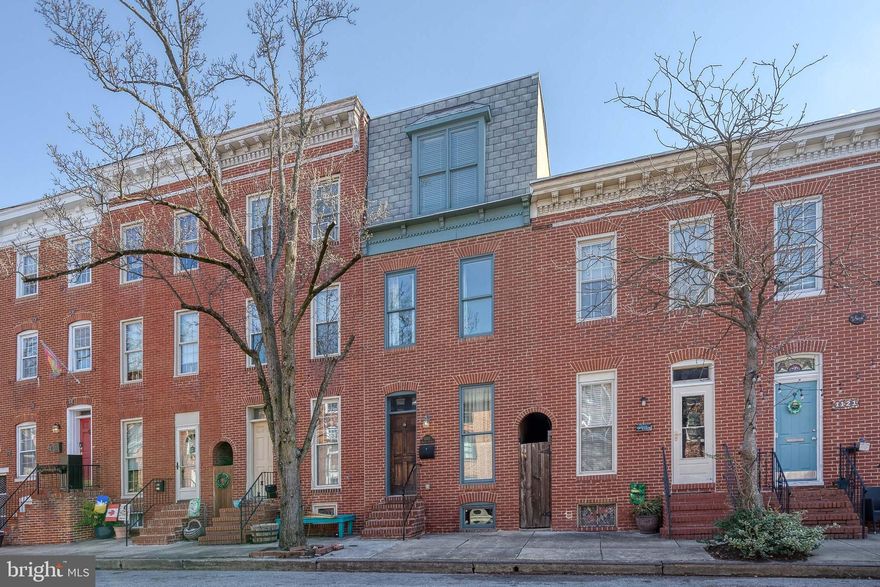 Price improvement!  If you are looking for a luxury home in the historic Federal Hil neighborhood in Baltimore, then this is it!  This incredible home offers classic Baltimore exposed brick walls, rustic hardwood floors, a totally renovated designer kitchen, and a powder room all on the main level.  You can pull right into your parking pad for added convenience.  The kitchen is a chef's dream with stainless steel appliances, hanging pot rack, granite counters, breakfast bar, and a true separate dining space, ideal for dinner parties and fun gatherings.  The next level offers two HUGE bedrooms that share a deluxe bath.  Both bedrooms have great closet space and tons of natural light.  The top floor of the home is the primary suite with roof deck access.  The primary suite offers a luxury bath with a double vanity and walk in shower plus a huge walk in closet.  The roof deck offers expansive city views and is the perfect place to enjoy the Baltimore skyline.