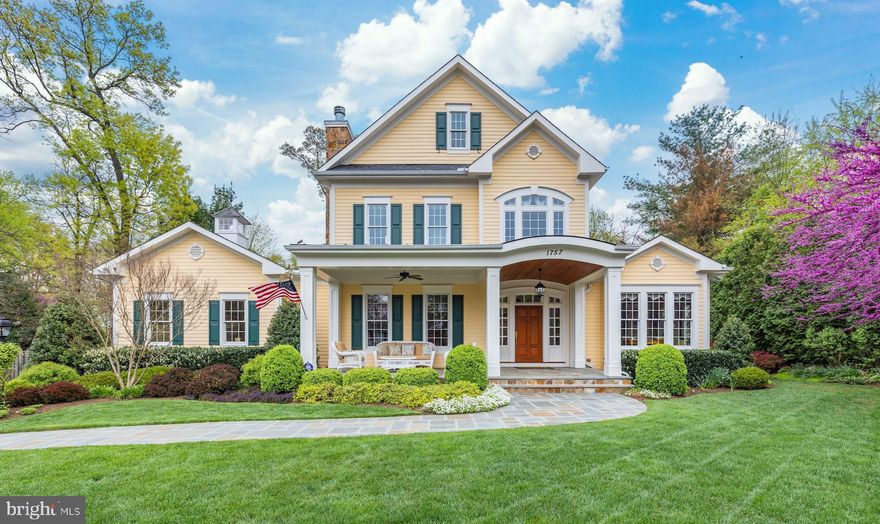 Sited atop a gentle hill, this beautiful home and half-acre of landscaped grounds featured in the annual Historic Virginia Gardens Tour provides a quiet, park-like setting with a flat yard, quality construction and thoughtful open layout and main level primary bedroom – close to 5300SF of impeccable design with Plentiful windows, built-ins and updated light fixtures combine down-to-earth family living with luxurious details. This home includes membership in the prestigious Cardinal Hills Swim and Racquet Club.   An extra wide stone walk leads to the gracious slate porch, arched entryway and a custom-designed mahogany door, sill, sidelights and transoms. The home's plentiful windows provide incredible light throughout and artfully designed garden views – curated for low maintenance and maximum aesthetic effect inside and out.     In the foyer, transoms and French doors provide a bright welcome. The layout, excellent for entertaining flow, supports ample choices for those seeking privacy or joining party gatherings.  A library / den offers a gas fireplace, dark wood, and beautiful built-in desk with bookshelves. The dining room, sited to capture light from morning to night, can also double as a sunroom and/or second office with white built-ins and a window seat.  Beyond pocket doors lies an open floor plan with family room / dining / kitchen combination.  The Gourmet kitchen is optimized for multiple cooks with two dishwashers, two sinks, a fridge as well as fridge drawers, and two microwaves. The open plan offers a gas fireplace, built-ins, and French doors leading to the outdoors.  A separate luxury suite includes a highly popular primary bedroom on the main floor with gas fireplace, ensuite bath, expansive views, remote-controlled blinds, and oversized walk-in-closet/dressing room.  The luxury bath features a heated floor, large shower with generous bench, 3 shower heads, and a jetted tub in an arched alcove overlooking gardens.  The nearby laundry/mudroom provides access to the back yard and plenty of storage.  Designer details throughout the home include various ceiling treatments, multiple window seats, special lighting, custom moldings and trims, built-ins, granite, travertine, and speakers in the den, primary bedroom and family room.  Upstairs offers 3 large bedrooms with special windows, two baths (ensuite and Jack and Jill), and an additional laundry room.  The lower level has a large rec room, its own full bath, generous storage, and more than 2200 unfinished SF for expansion. Serenity reigns in the flat rear yard, almost fully fenced, with pergola, landscape lighting, irrigation and lush landscaping designed to offer year-round appeal.  Multiple porches, a Trex deck, a stone patio, and seatings in garden “rooms” create numerous opportunities to enjoy the peaceful outdoor setting.  Be sure to drive by at night and enjoy the lovely illuminated exterior; the lit cupola is the icing on the cake.  Captivating curb appeal awaits in this one-of-a-kind custom home located in the heart of Vienna’s Madison High School Pyramid.
