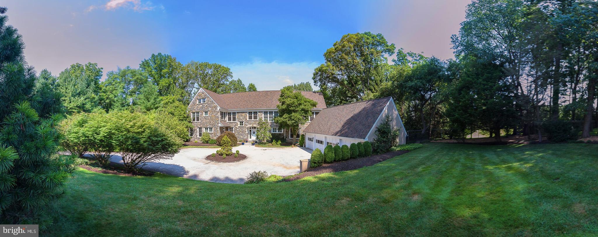 Note: Seller has retained an attorney to file and pursue a Residential Real Estate Assessment Appeal before the Board of AssessmentAppeals of Montgomery County. At the end of a private cul de sac is an 8682 square foot treasure. This gracious stone Colonial was designed by Lyman Perry of Nantucket and the Main Line and built by Mark Hallowell. The home was custom-built in 1991 for a family of six plus one set of in-laws and sited on the premier lot in Sydbury Glen. They chose Sydbury because of its privacy and proximity to schools, hospitals, shops, restaurants and transportation to both Center City & NYC. The two-story marble floored Entrance Hall draws you in to the impressive Living Room with nine and a half foot ceilings and oak floors. On the far wall there is a gas fireplace with a lovely slate surround and classic mantle piece. A wall of windows and French doors lead to a spacious outdoor deck with a view of the private fenced back yard and surrounding conservation area. It's a perfect spot for pre-dinner socializing with friends and family. The deck also showcases another set of French Doors, which lead into a grand Family Room. A gas fireplace also graces one wall with oversized windows allowing light to flood the room. Additionally, a small kitchen with cherry wood cabinets is available for snacks. No one needs to go far, or interrupt that heated game of pool or charades for something to eat! Across the foyer is an elegant Dining Room with French doors that accesses a small patio that overlooks the park-like setting with a custom-designed swimming pool. All first-floor doors have transom lights allowing natural light to fill every room throughout the year. In 2018, all of the more than 100 windows and French doors were replaced with Marvin Ultrix windows. The roof was replaced in 2017. The primary Kitchen space is divided into three areas all open to each other. Granite counters, rich cherry cabinets and newer commercial appliances create a work space to be coveted by both experienced and aspiring cooks. A cozy Family space for relaxation and a Breakfast area all combine to make it easy for a family to participate and share in the fun of mealtime. The Pantry, Powder Room, and large coat closet are steps away. The Back entry/Mud Room is perfectly located between the Kitchen and four car detached garage. A gracious main entrance is complemented by an additional front entrance providing direct access to a separate In-law Suite with a large bedroom and private bath. This area is close to the Family Room's petite kitchen and, as needed, may become a desirable first floor Guest Suite or private Home Office. A formal stairway in the front hall and an additional back stair lead to a full Second Floor. A luxurious Master retreat is composed of a Sleeping Room, Dressing Room and Sitting Area. Large windows, skylights, and a vaulted ceiling create the impression of living in a tree house and bring a Wow! from all who see it. Of course, a large Bathroom with skylight, double sinks, Jacuzzi, and Stall shower are essential parts of this Suite. Five additional large Bedrooms are served by three full Bathrooms along the second-floor hallway. Conveniently there is also a full Laundry Room and a large storage closet. Pull-down stairs access a full attic. Need more storage space? A full basement boasts a large finished room, a utility room and two unfinished rooms, one with a work bench and potential second laundry. The powder room could accommodate a tub or shower to convert to a full bathroom. These large lower level spaces provide ample room for a wine cellar, movie theater, workout studio or dry storage. Whatever you may choose to do, you will enjoy this most special home in its desirable & walkable neighborhood. Just like the current owners, you and your family will love living in Sydbury Glen.