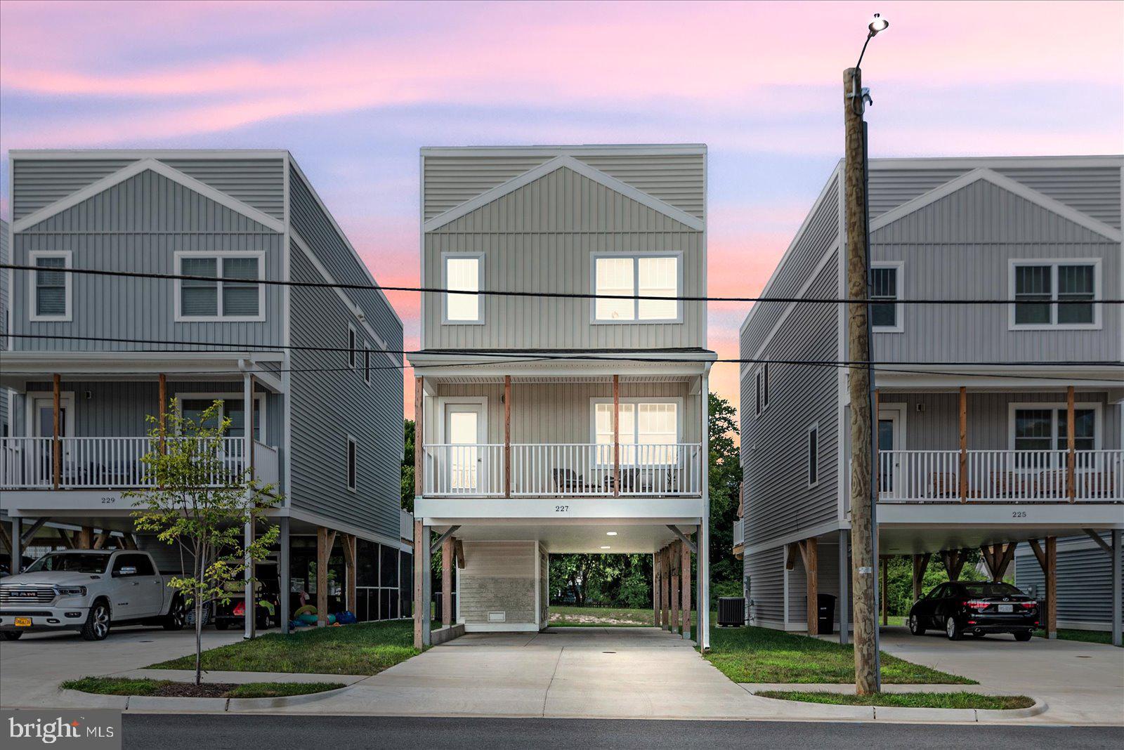 Modern Coastal Living in the Heart of Colonial Beach
Welcome to School Hill Townes, a vibrant community where modern coastal style meets easygoing river town living. This 3-bedroom, 2.5-bath single-family home offers a light-filled, open-concept main level with spacious living, dining, and kitchen areas—perfect for both everyday comfort and entertaining.
Step out onto your covered balcony and take in Potomac River views, and enjoy the convenience of covered parking for up to 3 cars underneath. Designed with a focus on both indoor and outdoor living, this home invites connection with neighbors and friends. It's perfectly located to take advantage of the walkable charm of downtown Colonial Beach just steps away.
Inside, you'll find beach-inspired finishes and colors, and a layout that feels fresh, open, and inviting. Whether you're looking for a weekend escape or a full-time residence, this home delivers the best of river town lifestyle in a low-maintenance, modern package.