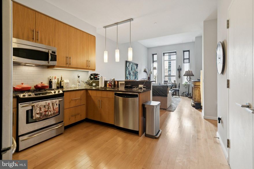 Beautifully updated one bedroom with sunrise city views at The Aria. This contemporary home features tall windows that provide excellent natural light and Center City views, high ceilings, modern finishes, and hardwood floors throughout. Enter through the foyer with deep coat closet into the spacious great room with light-filled living/dining room offering excellent entertaining space and an open modern kitchen. The sleek kitchen offers ample flat wood cabinetry, granite countertops, white subway tile backsplash, stainless steel appliances, and a breakfast bar. The generously sized bedroom enjoys beautiful natural light, a deep wall closet, and plush carpet. Adjacent is the full hall bathroom appointed in marble with a sleek wood vanity, TOTO toilet, and tub shower. There is a laundry closet with stacked Bosch washer/dryer and additional storage space throughout. Residents of The Aria enjoy a state-of-the-art fitness center, a spacious entertaining suite with thoughtfully appointed kitchen, a meeting & conference center, lounge, 24-hr concierge, parking, storage in basement and a luxurious pet spa with special services. Located in the Rittenhouse Square neighborhood, Aria residents will appreciate living in the heart of the city’s cultural epicenter, with world class shopping & gourmet dining.