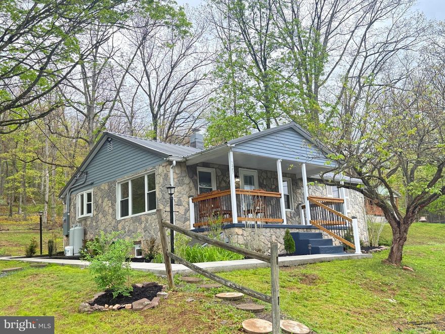 KEYSER – COMPLETELY REFURBISHED BUNGALOW WITH 100% FIELD-STONE EXTERIOR, VINYL SIDING, NEW VINYL DOUBLE HUNG WINDOWS, COVERED FRONT PORCH W CONCRETE FLOOR/STEPS, CONCRETE WALKWAY, UNDER PORCH STORAGE, PARTIALLY FENCED, LAKE VIEW AND SITUTED ON PRIVATE FULLY WOODED 1.12 ACRES OF LAND.    INTERIOR OFFERS LIVING ROOM WITH 3” LAMINATED HARDWOOD FLOORS, KITCHEN WITH ALL NEW APPLIANCES, CENTER ISLAND & NEW COUNTERTOPS.   LAUNDRY ROOM INCLUDES WASHER & DRYER.    3 BEDROOMS (FRESHLY PAINTED) WITH NEW LAMINATED H-WOOD FLOORING & NEW CEILING FIXTURES.  FULLY REMODELED BATH WITH LARGE SINK/OAK VANITY, TUB/SHOWER COMBO, WALL MIRRORED MEDICINE CABINET W DECORATIVE LIGHTING, T&G WALLS AND LAM. H-WOOD FLOORING. NEW WIRING THRU OUT. PERFECT FOR FIRST TIME HOME BUYERS WHO WANTS A HOME AT A REASONABLE PRICE.  CALL FOR VIEWING AND SEE FOR YOURSELF!!!