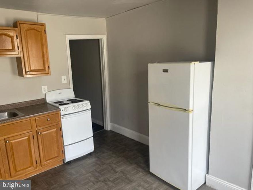 One Bedroom Grays Ferry Apartment Available NOW - Updated, large, second floor apartment for rent. There is a front living room area that connects to a separate spacious bedroom.  The eat in kitchen is equipped with fridge, stove and plenty of cabinet space.  Modern bathroom with tub.Public transportation is easily accessible. Short walk to the Fresh Grocer of Grays Ferry shopping plaza. Pets negotiable.First, last and security deposit required for move in. $50 application fee. Tenant pays water and electric.