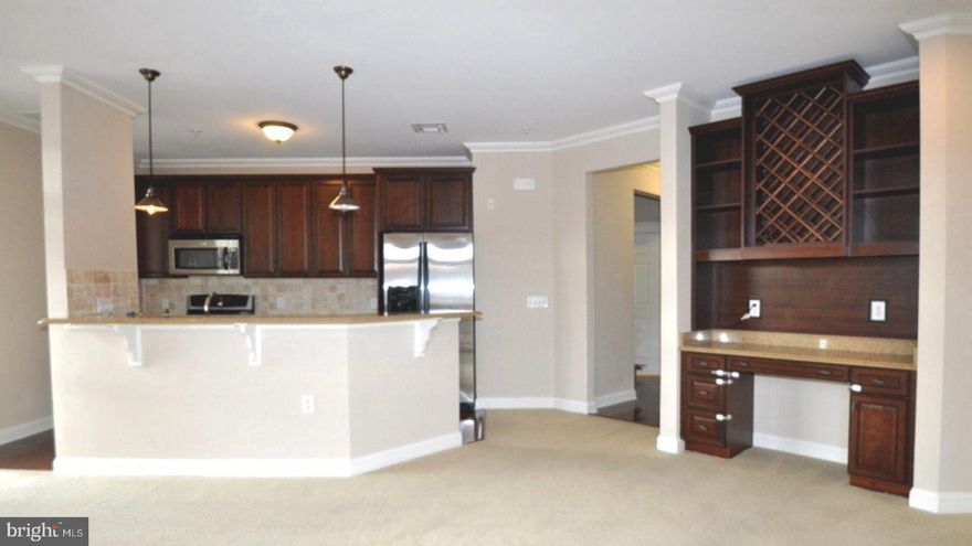 Expansive 2-Bedroom, 2-Bath Corner Condo with Premium South Exposure, Bathed in Natural Light! Welcome to a home that seamlessly blends comfort, style, and convenience. This beautifully maintained 2-bedroom, 2-bath corner unit, one of the largest in The Grande at Riverview, offers a peaceful retreat in the heart of Conshohocken, where thoughtful design meets everyday functionality. Step inside and immediately feel at ease as sunlight pours through expansive south-facing windows and sliding glass doors, filling the space with warmth and a bright, airy ambiance. Two private balconies invite you to sip your morning coffee with a view or relax in the evening with a gentle breeze. The open-concept layout flows effortlessly from the spacious living area into a refreshed, thoughtfully designed kitchen, complete with classic traditional cherry cabinetry, sleek granite countertops, stainless steel appliances, and a stylish bar-height peninsula, perfect for casual dining or entertaining. A charming butler’s pantry adds both elegance and extra storage to the space. The oversized primary suite is a true sanctuary, comfortably accommodating a king-sized bed and featuring a custom walk-in closet with built in closet system. The spa-like en-suite bathroom offers a serene escape, with double vanities, a soaking tub, and a frameless glass shower. Situated on the opposite side of the unit for added privacy, the second bedroom is spacious and sunlit, ideal for guests, a home office, or a cozy den. This freshly painted unit features beautiful crown molding throughout and upgarded newly installed carpet. A full-sized washer and dryer tucked neatly into a laundry closet, central air conditioning, and ample closet space for storage throughout. Highlights You’ll Appreciate: reserved garage parking,  secure key fob entry, dedicated mailroom, and on-site property management, access to a private fitness center, resident clubhouse, and a resort-style outdoor pool, direct access to the scenic Schuylkill River Trail, ideal for running, biking, or leisurely strolls
Best of all, you’re just steps from the heart of downtown Conshohocken, where you can explore lively restaurants, cafés, shops, and seasonal events. With regional rail and major highways (I-76, 476, 202) just minutes away, commuting to Center City, King of Prussia, or Valley Forge couldn’t be easier.
This home isn’t just a place to live, it’s a space to thrive. Move-in ready and easy to show, this rare corner unit won’t stay on the market for long. Schedule your private tour today and discover why this is the one you’ve been waiting for! This is truly a must-see property to fully appreciate the spacious layout and beautiful finishes, photos simply don’t do it justice. Please note, the unit is currently occupied, and per the seller’s request, the listing features previously taken photos provided by the seller.