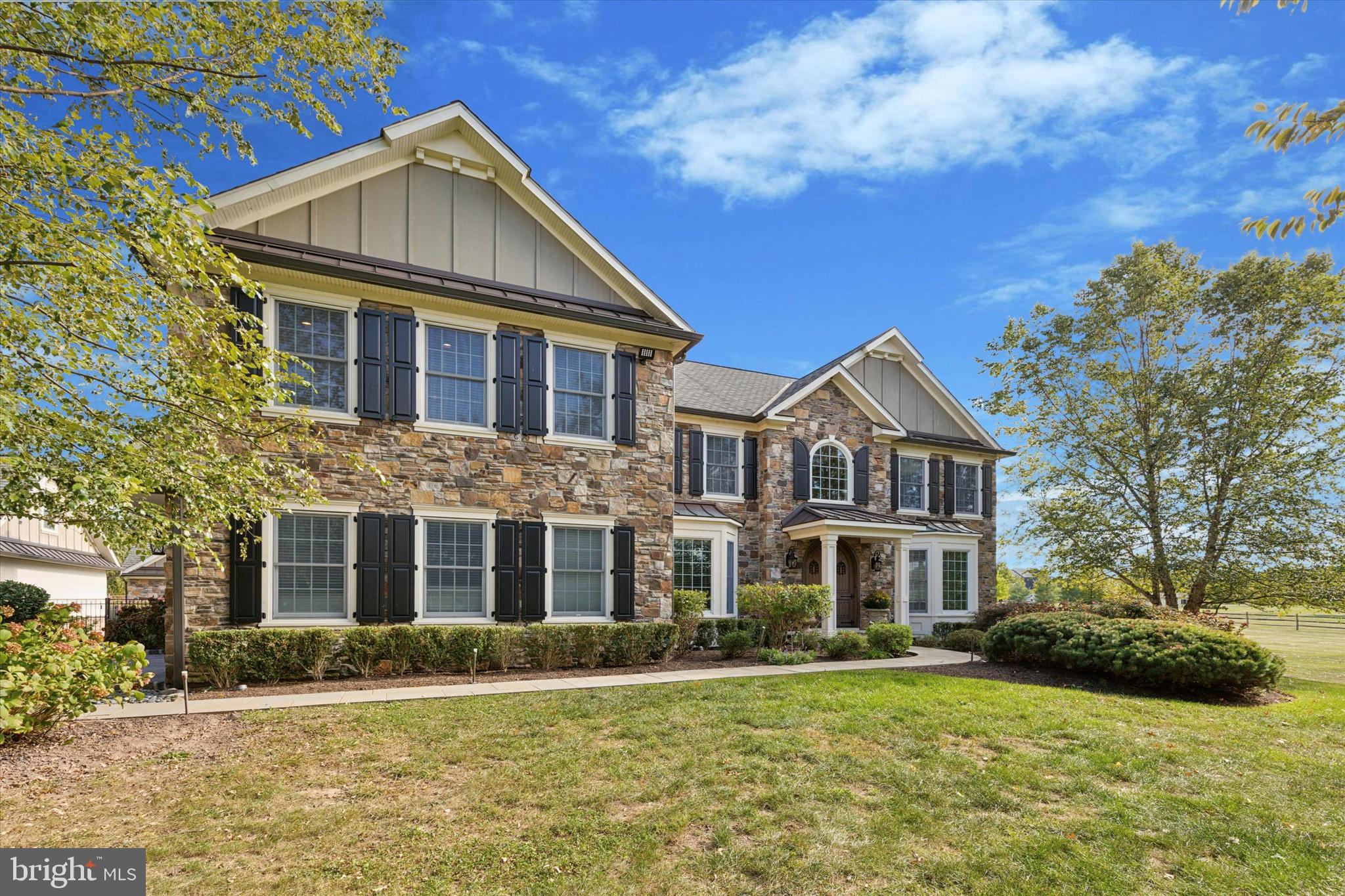Located in Beautiful Worcester Township, this home was Totally Redesigned and Remodeled to create an entertaining haven boasting loads of square footage to spread out over, while also sitting on 3.5 acres. No detail was overlooked and not much can be added to this home, because it already exists!! Enter the property off of Dell Rd through the electric gates, banked with masonry and Blue Stone walls. Ample parking is located behind the walls that offer privacy and seclusion. The entire exterior of the home was remodeled using the finest materials with attention to the detail given on every façade including new windows, Wood Shutters and a 50 Year Roof. The Main front entry features a Double-Solid Wood entry door, with a mahogany ceiling, and a Blue Stone walkway leading you to it. Enter into the 2-Story Foyer with its floor to ceiling stone clad walls featuring niches, the main staircase with metal railing, and large chandelier that can be lowered for ease in cleaning! Off of the foyer you will find a Private Home-Office and large living room open to the Dining Room. The Eat-In kitchen features a large island that seats 6 comfortably, built-in appliances, Double-Oven, Wet Bar / Coffee Station with a sink. Off of the kitchen there is a "Pet" Room, an Over Sized laundry room with Built Ins with room for an Extra Frig/Freezer, a Dry Station/Bar, the 2nd staircase and a Side Entry covered porch. Adjoining the kitchen is the family room with vaulted ceilings ,gas fireplace with floor to ceiling stone, and built-in TV with addt'l storage cabinets. The 2nd Floor houses the M. Suite and 4 additional bedrooms. The M. Bedroom includes a large M. Bath with 2 separate vanities, Glass shower, Commode closet, Freestanding tub ,and radiant floor heat! This M Suite also includes (2) Separate walk-in closets, and a 3rd Walk-in Shoe Closet, Linen Closet and Hardwood floors throughout. Down the hall, with its Hardwood floors, there are (4) additional Bedrooms all with walk-in Closets, and (2) of the four bedrooms feature In-Suite bathrooms !! The last (2) bedrooms share a common hallway bathroom. There is tons of storage closets in this house!!!! Adding to the square footage is a Finished WALK-OUT basement for more entertaining options!! You will find a wet bar here, mini-frig, room for the hanging out and watching TV, and additional space to unwind in! There is a full bathroom on this level along with a gym room. Walk out the sliding door of the kitchen to the rear PARADISE that is secluded and private, and into an Amazing 4-Season Room . Again.....Nothing was overlooked here!! Stamped concrete floor, Mahogany ceilings ,Stone Gas Fireplace, Wall Mounted TV, Heated, and a Large Dining table next to the Lounge area! Also an Over Sized flat-top grill (Think Hibachi nights) Built-In BBQ, Mini fridge and granite countertops! Step down onto the stamped concrete pool deck where you will find EVEN MORE entertaining space!! The pool area is enclosed with an aluminum fence and includes: Salt Water/ Heated pool, Travertine and Blue Stone accents, Waterfall from the Hot Tub into the pool, Sliding board, LED Lights, and an Upper-Deck for addt'l Lounging space. Next to the pool is the Pool House that features a Full Wet- Bar with Seating, Rollup Security Door, Refrigerator, Ceramic Floors, Granite Counters, a storage room for pool supplies, and a Full Bathroom with Built-Ins!! You really would never want to leave your backyard given all that this property offers with its many entertaining options!! The home has an attached 2-Car Garage but the Detached 3-Car garage is a dream come true for any car collector or Hobbyist. This has a marbleized Epoxy Floor, is heated, Extra Deep, LED lights, a 1/2 Bath, and FULLY Finished 2nd Floor. Property is protected by a Whole House Generator! Look at the Pics, and make an Appt! They won't allow any more words here...But I promise this home is FULLY Loaded and nothing was left out in the Details of this fine home!!!