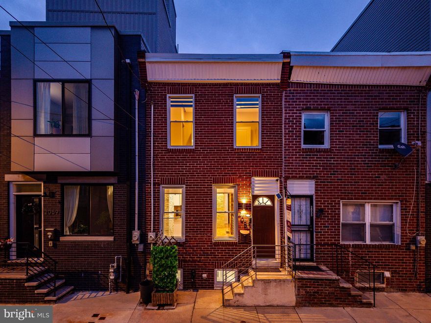 Located in Philadelphia’s Point Breeze neighborhood, this updated 2 bedroom, 1.5 bath townhome offers efficient space and modern finishes. The main level features an exposed brick accent wall and an open living and kitchen area with stainless steel appliances, drink fridge, and stacked washer/dryer. A half bath sits at the rear of the home. Step outside to a fully fenced backyard with new deck flooring, awning cover, grill, and storage area, creating a private outdoor retreat. Upstairs, both bedrooms connect to a brand new full bathroom with soaking tub, walk-in shower, and new vanity. The finished basement provides flexible space for office, gym, or media use, plus a utility area with furnace and water heater. Enjoy easy access to public transit via the Broad Street Line, neighborhood parks, and nearby dining options including Hardena and Two Eagles Café.