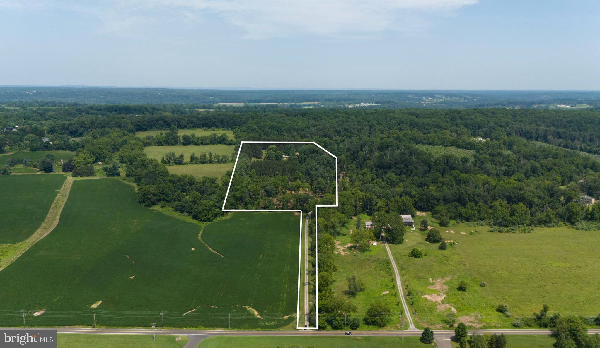 Welcome to Firefly Pines - Sophisticated country living. A truly rare opportunity to build your dream home on 19+ acres of land that is not currently deed restricted. Enrolled in Act 319 (clean & green) for significant ongoing tax savings while not under conservation easement. This exceptional property offers a combination of privacy, flexibility, and strategic value. Perched at a desirable elevation with gently rolling topography, a natural freshwater spring and expansive seasonal views. This is more than land - it's a remarkable legacy asset. With no current deed restrictions, the future owner maintains full control of land use. For those with an estate planning lens, this property presents a unique potential opportunity to unlock substantial federal and state tax deductions, and estate tax exclusions through future land preservation - a powerful vehicle for both wealth preservation and environmental stewardship. In a township where most of the larger parcels are already preserved, this property is atypical with a remarkable long-term upside. Sold as is. Located in the award-winning New Hope- Solebury School District, minutes from downtown New Hope and the Route 202 commuter corridor; 69 miles miles from the Holland & Lincoln tunnels; 67 miles to Verrazano Bridge; 21 minutes to Princeton & 45 minutes to Philadelphia. Centrally located to rails & airports.
