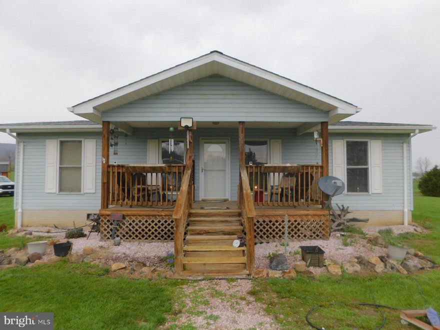 Great  opportunity for a first time homebuyer or someone looking to downsize. This cute bungalow has 4 bedrooms and 2 full bathrooms and sits on a 1 acre lot with empty fields behind the house. This easily managed house has a nice sized living room and  a spacious kitchen with an island to have your meals. On one side of the house is the primary bedroom and bath and another bedroom. The other side of the house has 2 bedrooms and a shared bathroom perfect for guests.  There are beautiful mountain views. Shopping is just 
 minutes away. There is an HOA with minimum restrictions.