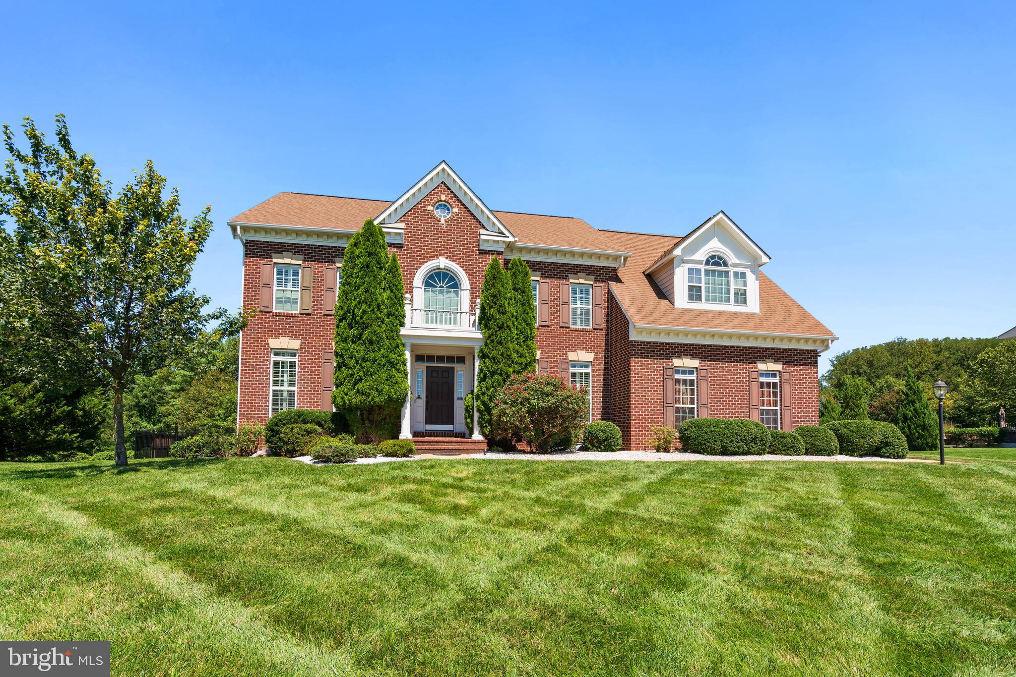 Immaculate property on a premium lot now available in exclusive Woodmore North.
This stunning home offers over an acre of total privacy in one of Bowie’s most sought after communities. Finished across all three levels, the home boasts generous living spaces, refined finishes, and a floor plan designed for effortless flow from room to room.
The backyard is a show stopper. Perfectly flat and square, the grounds feature a professional 10-zone irrigation system that keeps the landscape lush, enclosed by an upgraded six foot black sailwind aluminium fence, and anchored by a large hardscaped patio with a built-in fireplace. It’s pool ready, with plenty of space for entertaining or relaxing. A conservation area at the rear corner ensures privacy and protection from future development, preserving your investment for generations.
Inside, the home is equally impressive. The bedrooms are spacious and expansive. The master bedroom affords total privacy and the upstairs alone has three full bathrooms. The kitchen is immaculate and adjoins a morning room that looks out to a large and open private yard. A distinctive rotunda-style home office makes working from home both elegant and functional, and the basement is finished with a bedroom and full bath as well as an impressive wet bar, tons of storage, and even enough space left over to create your own home theater or gym.
Beyond the home itself, the location is unmatched. Set on a premium lot within Woodmore North, you’ll enjoy suburban living while being 20 minutes from the DC line, while still benefiting from everything Bowie has to offer, and not to mention HOA fees remain very reasonable. Bowie itself is a wonderful, vibrant, and proudly diverse community boasting an incredible array of amenities including numerous private pools, a university and two gorgeous libraries, a performing arts center, our own dedicated police department, a public splash park, ice rink, skate park, dog park, Allen Pond, White Marsh Park, an eighteen-hole golf course, and our own minor-league baseball team with its beautiful stadium.
For any questions please give us a call or ask your realtor to contact us and we will get the answers to you right away.