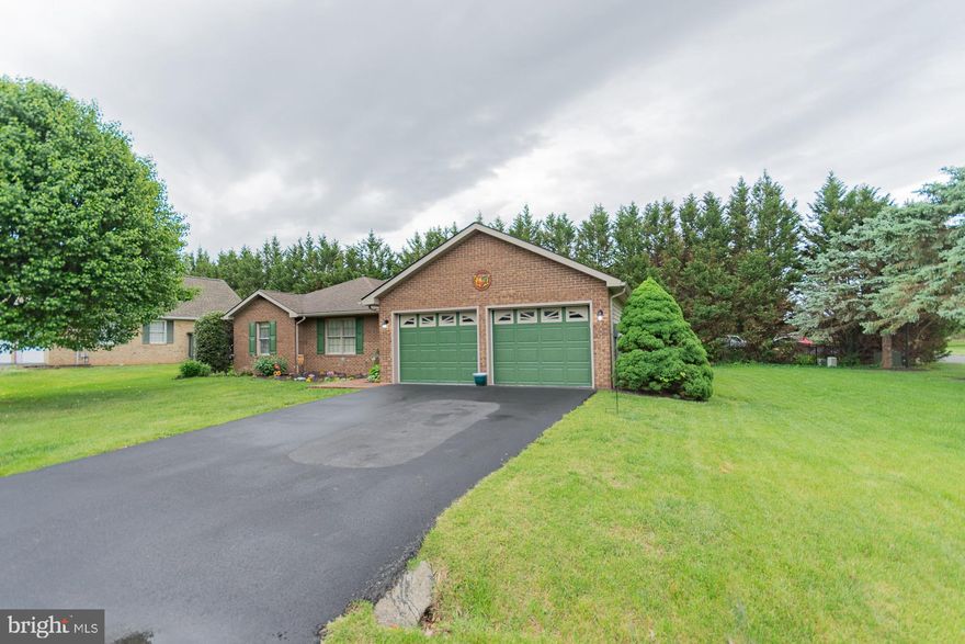 Welcome to an exceptional opportunity in one of the most desirable areas of Martinsburg. This beautifully maintained brick-front rancher offers the perfect blend of comfort, charm, and thoughtful updates—all set on a lovely corner lot.

Featuring 3 bedrooms and 2 full bathrooms, this home is surrounded by mature evergreen trees, lush landscaping, and rich, velvety green grass that create a truly inviting curb appeal. Inside, you’ll find a warm and functional layout designed for easy living.

The recently renovated kitchen shines with updated cabinetry and granite countertops, offering both style and practicality for everyday use and entertaining. Just beyond, the rear sunroom provides a bright and relaxing space to unwind, enjoy your morning coffee, or take in the peaceful surroundings year-round.

The primary suite includes a wheelchair-accessible roll-in shower, adding both convenience and flexibility. Additional highlights include a newer roof and an HVAC system approximately 10 years old, reflecting the care and attention this home has received over time.

With its desirable location, thoughtful features, and well-maintained condition, this home is a standout in a wonderful neighborhood. Don’t miss your chance to make it yours—schedule your private showing today before this opportunity passes you by.