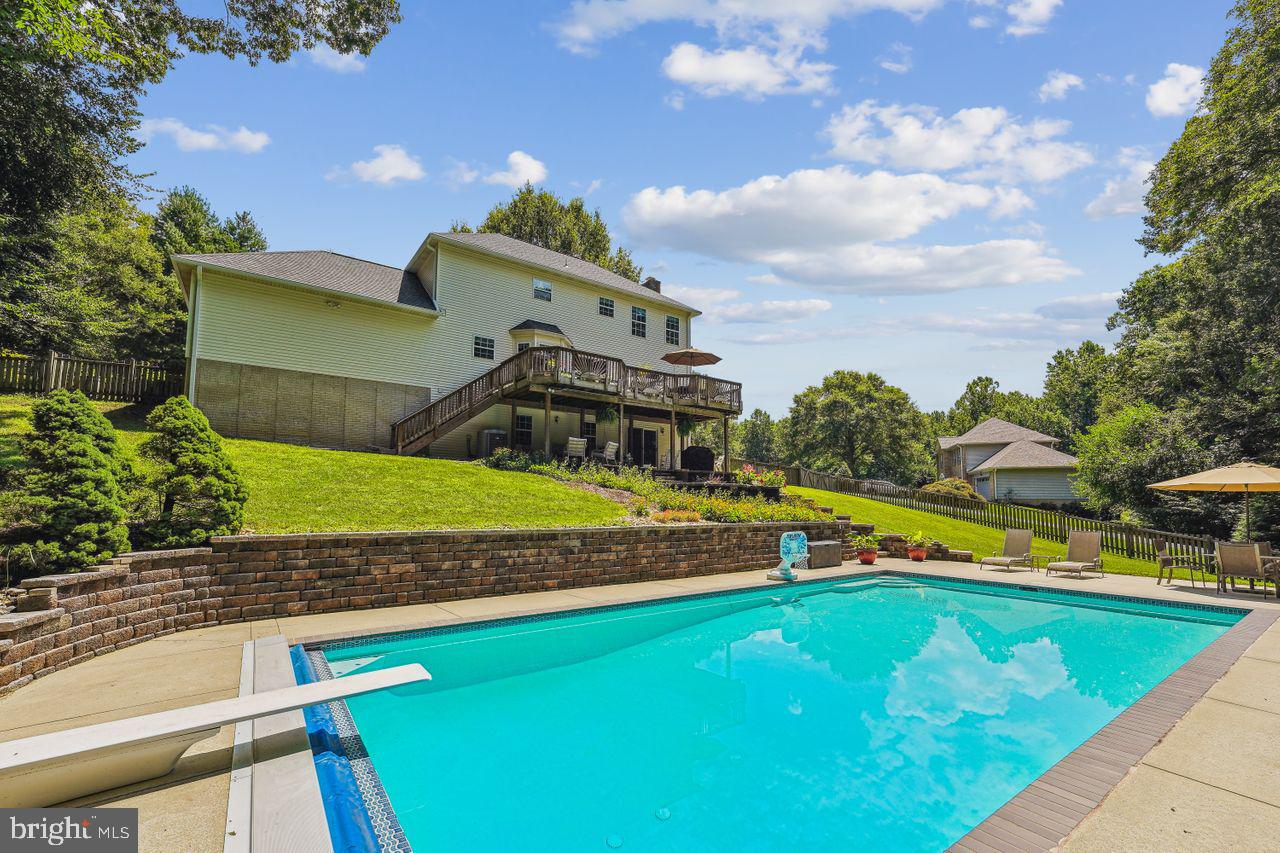 OFFER DEADLINE AUGUST 4TH AT 10:00. OPEN HOUSE WILL BE CANCELLED ONCE UNDER CONTRACT. Nestled at the end of a quiet cul-de-sac, this charming brick-front colonial, situated on an expansive 1-acre lot, invites you to experience the ultimate tranquil retreat. Before you even step inside, lets discuss the FABULOUS backyard with a 20'x40'ft inground pool with diving board providing endless hours of summer fun and relaxation. The pool features a new filter and a two-year-old pump, ensuring crystal clear water. For added safety, there is also an automatic safety cover. The backyard is further enhanced by hardscaping and large deck, ideal for outdoor entertaining and enjoying the serene surroundings. Step through the front door into an inviting foyer that leads to a well-designed floor plan. The main level boasts a spacious family room, a gathering place bathed in natural light, ideal for relaxation and entertainment. The updated kitchen is a culinary haven with freshly painted cabinets, gleaming granite countertops, and stainless steel appliances, offering an inspiring setting for culinary adventures. The main level also features a convenient half bath, perfect for guests. The upper level houses three comfortably appointed bedrooms, each offering ample space and a serene atmosphere. The primary bedroom is a true retreat with a walk-in closet and an attached office space, providing a private haven for work or relaxation. The remodeled primary bathroom exudes luxury, featuring large walk-in shower, elegant finishes, and a sense of sophistication. The two additional bedrooms feature closet organizers, maximizing storage space and organization.Â
This home embraces versatility with a full bedroom and bathroom on the lower level, perfect for hosting guests or creating a dedicated home office. Enjoy peace of mind with a hardwired security system and modern conveniences such as SMECO's powersaver home energy efficiency program, nest protect smart smoke detectors, and a Lutron Smart Hub smart device controller with diva dimmer and claro smart light switches in the kitchen and living room. Beyond the confines of your retreat, the Dunkirk area offers an abundance of amenities to enrich your lifestyle, including parks, ballfields, hiking trails, fishing ponds, and playgrounds. Restaurants and grocery stores within a short distance add to the area's convenience.
Schedule a private tour today and open the door to a world of refined living!