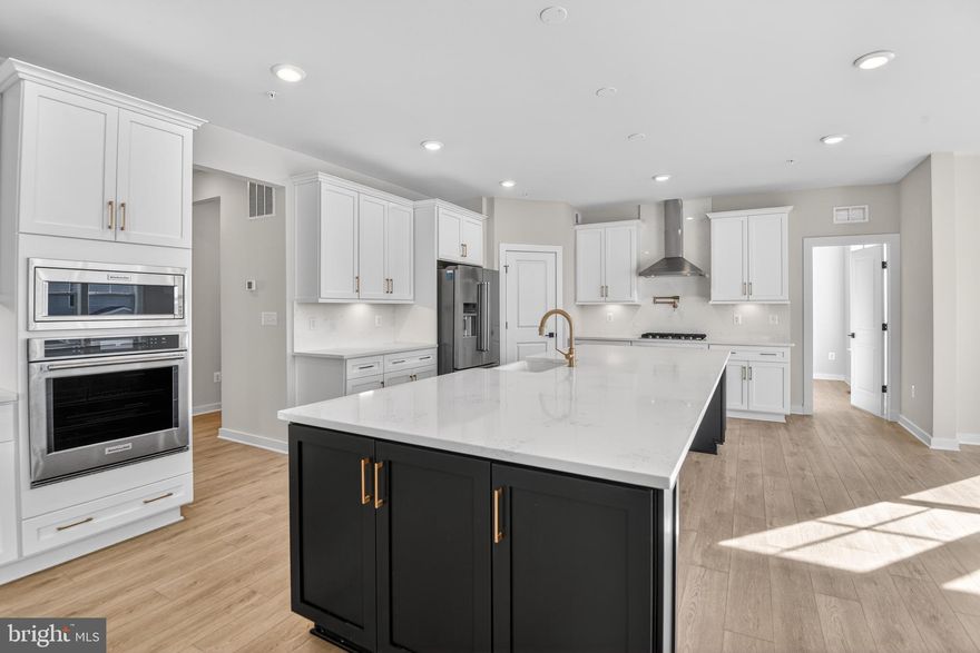 *OFFERING UP TO 20K IN CLOSING ASSISTANCE WITH USE OF APPROVED LENDER AND TITLE.*
BOWIES’S PREMIUM ESTATE HOMES OFFERING A PERSONALIZED DESIGN STUDIO EXPERIENCE!
NEW CONSTRUCTION AT SOUTH LAKE IN BOWIE MARYLAND. Welcome to the only quick move-in home available at South Lake! Thoughtfully designed for the entertainer in us all, the Emory's chef kitchen and morning room seamlessly flow into the family room, creating an ideal space for hosting guests. Continue throughout the main level to find dedicated areas for a home office, a dining room, and a study. As you make your way upstairs to the second level, you will discover an open-concept loft that connects to the laundry room and secondary bedrooms. Also accessible from the loft area is the primary suite, a secluded and luxurious haven that features a large sitting room, two walk-in closets, and a stunning bathroom designed to maximize relaxation and comfort. This home is a real show-stopper with its bonus coffered ceilings in the dining and family rooms, cathedral ceiling in the owners suite, hardwood stairs, rear covered porch with fireplace, PLUS SO MUCH MORE! Need more space? This Emory features a WALKOUT basement with a finished rec room, media room, bedroom and bathroom. Providing ample space to relax and unwind. Overall, the Emory II is a superbly designed floor plan that offers a perfect blend of style, comfort, and functionality. Contact the Community Sales Consultant to request additional information.