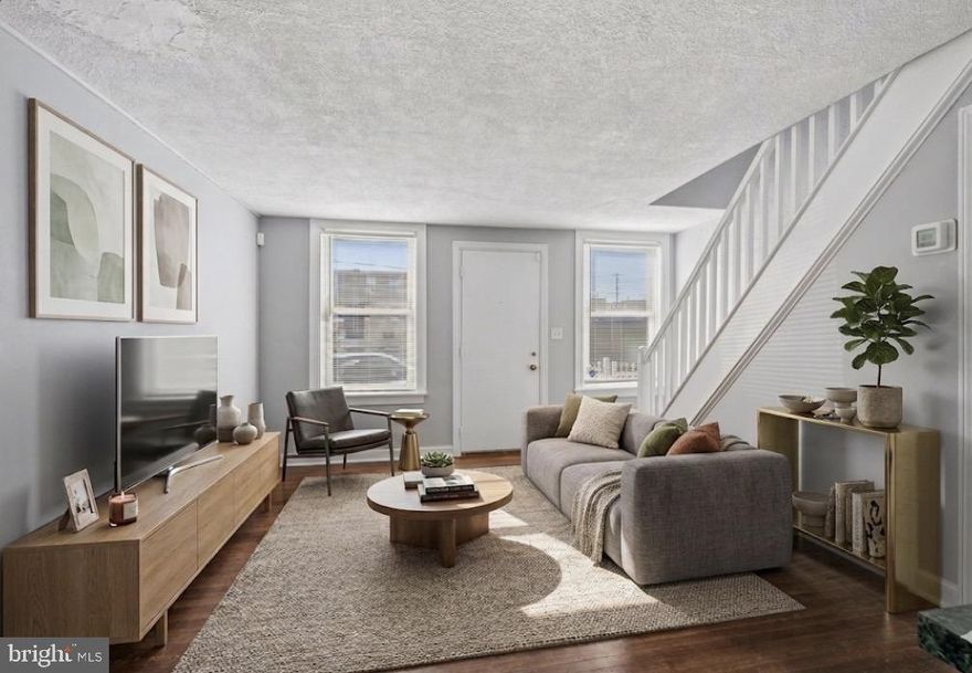 Welcome to 3606 Livingston Street, a beautifully maintained and sun-drenched rowhome that stands in this charming neighborhood. Upon entering, you are immediately greeted by gleaming original hardwood floors and an abundance of natural light. The inviting living room offers the perfect space for unwinding, while the transition to the kitchen is seamless thanks to a versatile breakfast counter—ideal for a quick morning coffee. The heart of the home is the spacious eat-in kitchen, which boasts recently updated stainless steel appliances, including an electric oven and refrigerator, with plenty of additional room for dining table.

The home’s layout is perfectly positioned to capture the daylight, with eastern exposure in the front and western sun in the rear. This orientation allows you to enjoy breathtaking sunset colors and stunning views of the Philadelphia skyline from both your front and back yards. These private outdoor spaces are a rare find, offering ample room for gardening, summer grilling, or lounging on your favorite patio furniture. Upstairs, the home continues to impress with two bright and cheery bedrooms featuring generous closet space, either of which could easily serve as a spacious primary bedroom or a quiet home office. The bathroom has also been thoughtfully refreshed with updated flooring, toilet, and a crisp, modern paint palette.

For additional living space, head down to the partially finished basement, which features brand-new, waterproof wood-look vinyl flooring. This level provides the ultimate convenience with a dedicated laundry area equipped with its own washer and dryer—no more trips to the laundromat The washer is an almost brand new speed queen! Beyond the property lines, you are perfectly positioned for an effortless commute and lifestyle. Located just moments from I-95 and the Betsy Ross Bridge, this home offers rapid access to Center City and New Jersey. Public transit is equally accessible with nearby trolley and bus lines. For your daily needs, the Aramingo Avenue shopping corridor—featuring Target, Lowe's, and major grocery stores—is just minutes away, as are local favorites like Stock’s Bakery and the vibrant dining scene in nearby Fishtown. This home is a rare find that combines comfort, style, and convenience; schedule your showing today before it’s gone.