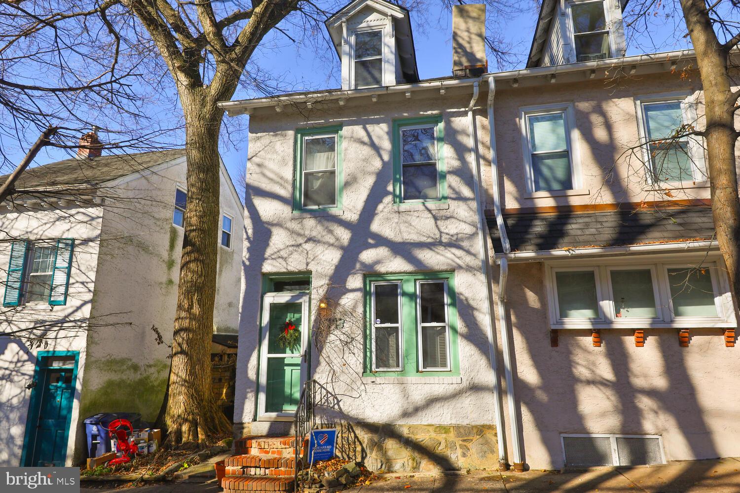 Homespun charm with a hipster edge - Welcome to one of the most colorful and friendly blocks in all of West Mount Airy. If you value independent thinking, have distinct taste, and appreciate culture and creativity, this is a home where you can hang your heart. This 2 bedroom, 1 bath straight thru semi detached home, built in 1800's, starts charming you as soon as you walk up the brick steps. Next, you will be welcomed by a beautiful front door, new roof. As you enter the living room, you will notice the built-in oak cabinet and Franklin stove fireplace. The dining room and retro kitchen are next, featuring views of the expansive greenery in the back of the house. The kitchen is fitted with oak cabinets, a large casement window, and a door leading to a gorgeous double garden. A wide staircase takes you upstairs to 2 bedrooms and a full bath, loft style home office all painted in muted earth tones. Intriguing accents abound, like built-in shelves, lo-luster pine plank floors, artist tiled basement and solid, old fashioned quality detailing. Perks of this house include newly installed natural gas hot water and house heaters, recent rubberized roofing, and perennial plants. All this within walking distance of the Wissahickon, two train stations, shopping, and a newly renovated library. You've seen the "I like Mt. Airy" front license plates with the smiley face. This house illustrates exactly why folks like living in this area so much! This is an incredible opportunity for those looking for a piece of history that has been lovingly tended to for over a century, nestled in the heart of West Mt Airy.
This three story twin sits on a quiet, one way residential block and offers a rare double lot garden. If you appreciate random width plank floors, hand cut joists, and thick stone walls 113 W Durham Street will not disappoint. Believed to have been built back in 1859, this 2 bed, 1 bath home has an expanded footprint and offers nearly 1,400 square feet of living space throughout the home. As was classic for the time, the front door is oriented to the side garden, creating a sweet energetic buffer from the street. The first floor of the home offers a traditional living room and dining room, both with original pine plank floors and windows with deep window sills. This layout is perfect for someone who wants an pen floor plan that also allows for flexibility of furniture arrangement. A door from the kitchen leads to the fully fenced in and incredible backyard, a secret garden retreat sure to delight green thumbs and those seeking a peaceful outdoor retreat. On the second floor of the home you will find a combination bathroom/dressing room with an original standard tub, perfect for soaking all winter long, beautiful natural light, a closet, and plenty of space to get ready for the day. The third floor of the home is an open loft style bedroom with tall ceilings and lovely natural light. Beyond being steeped in historic allure and classic architecture, 113 West Durham Street is also very conveniently located, walking distance to bus and train lines, and all the bars, restaurants and community events Mt. Airy has to offer. (do not open glass sliding doors; kindly walk around the side to get to the yard)