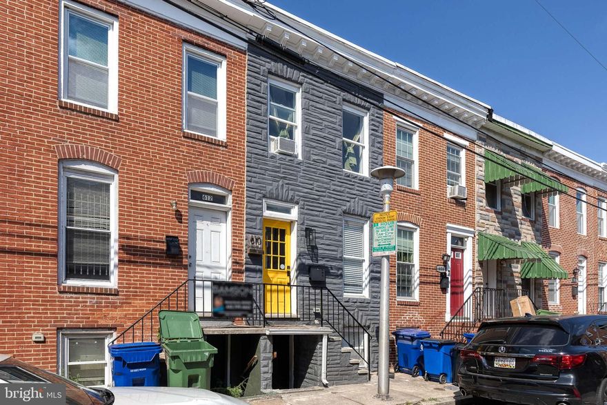 Welcome to Wyeth Street in Washington Village! This beautifully updated 3-bedroom, 2-bath home offers the perfect blend of modern style and luxurious comfort. Step inside through the cheerful sunny yellow door, which leads to a stylish living room adorned with custom moldings, built-in shelving, recessed lighting, and sleek LVP flooring.  Beyond the living room, you’ll find a kitchen that’s truly a Chef’s dream. The space boasts rich espresso cabinetry, stainless steel appliances, built-in shelving, and a striking custom tile backsplash. Pendant lighting above the peninsula complements the gleaming quartz countertops, creating an ideal setting for both cooking and entertaining.  A full bath is conveniently located on this level, as well as access to the private, fenced back patio—perfect for enjoying summer BBQs or a peaceful evening outdoors.  Upstairs, the two generously-sized bedrooms are flooded with natural light, providing a serene retreat. The lower level offers versatile living space the could be used as a bedroom, or rec room, family room, or office area—plus another fully renovated bathroom.  With its blend of modern design, thoughtful updates, and plenty of space to live and entertain, this home has everything you’ve been looking for!
