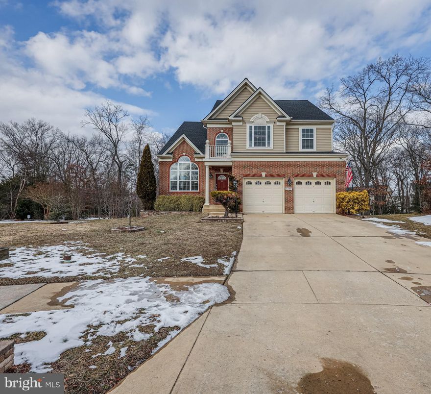Welcome to 7904 Stallings Drive, a stunning 5 Bedroom home on a cul de sac in the Tanyard Springs Community. This charming covered front porch leads into a two-story foyer that sets the tone for the spacious interiors. The hallway features hardwood flooring that extends into the kitchen, ensuring easy upkeep. The living room is a bright and airy space with a soaring vaulted ceiling, plush carpeting, and Palladian windows that floods the room with natural light. Adjacent is the dining room, boasting a three-window bump out, chair railing, and crown molding, creating a perfect setting for formal gatherings. The kitchen is equipped with warm cabinetry, gorgeous granite counters, a kitchen island, stainless steel appliances, recessed lighting, and a large  pantry. Enjoy casual meals in the bright breakfast room, which opens to the rear yard through sliding glass doors. The family room features a cozy gas fireplace, ceiling fan, 
and surround sound, making it an ideal spot for relaxation. The main level also includes a laundry room and a large two-car garage for added convenience. Upstairs, you'll find generously sized bedrooms, each with carpeting, ceiling fans, and large wall closets. The hallway offers a large linen closet and a full bath with a tub-shower combination. The primary suite features vaulted ceilings, two large walk-in closets, and an ensuite bath with a double sink vanity, dressing station, soaking tub, walk-in shower, and water closet. The lower level is designed for entertainment, with a large recreation area, built-in surround sound, and a wet bar refreshment station, complete with a water source and space to add your refrigerator. It also includes a fifth bedroom, another full bath, and two bonus rooms that can serve as a home office, kids' playroom, or study room. An enormous storage area with built-in shelving completes this level. Recent upgrades include a new roof in 2024 and surround sound in the family and recreation rooms. The rear exterior features a stamped concrete patio, perfect for outdoor gatherings. This home is walking distance to amenities including the community pool, playgrounds, gym, clubhouse, garden center, tennis/basketball courts, dog parks, and walking and biking trails. East access to commuter routes to Ft Meade, NSA, Baltimore, Annapolis and Washington DC. Don't miss the opportunity to make this exceptional property your new home!