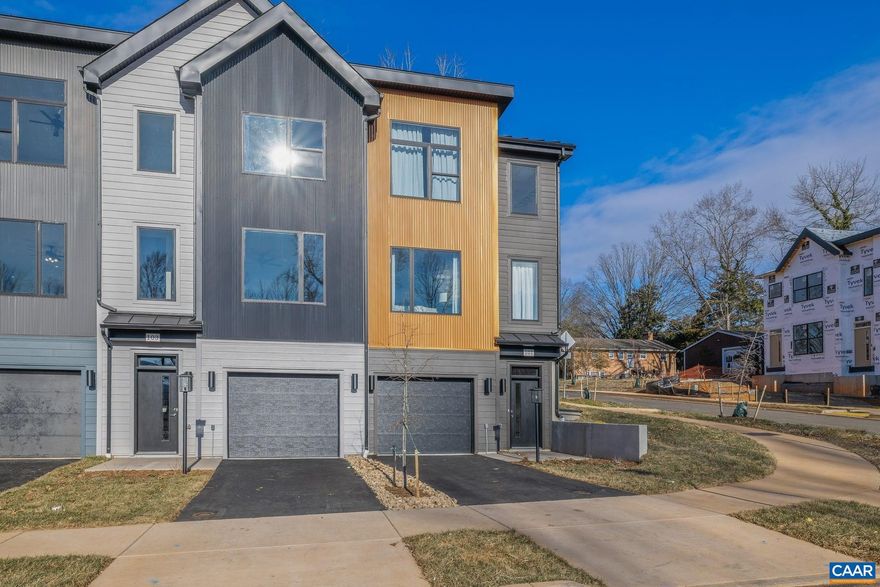 Welcome to urban living at its best! Located less than a mile from the University of Virginia Medical Center, Scott Stadium, public transportation, and minutes to Downtown Charlottesville, the new neighborhood of Flint Hill is all about city living! The Hinton is a contemporary townhome featuring James Hardie siding with complementary accents of corrugated metal panels, creating a cohesive and modern exterior. The entry-level provides flexibility with options for a bedroom, recreation room, or additional storage space, along with the choice of a full or half bath. This level also includes a convenient 1-car attached garage. The main level offers an open-concept design perfect for everyday living or entertaining. The kitchen is beautifully appointed with granite countertops, stainless steel appliances, and wood flooring. An optional rear deck extends the living space outdoors. The upper level features a spacious primary suite with a large shower and ceramic tile accents in the primary bath. Two additional bedrooms, a full bath, and a dedicated laundry room complete this thoughtfully designed home. Similar photos.,Granite Counter,Maple Cabinets,White Cabinets