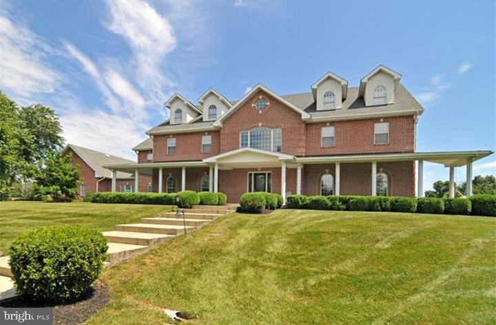 Welcome to this beautiful 7,600 square feet (sf) custom-built home situated on almost 6 acres of land. This Worcester beauty includes 4 Bedrooms, 4 full bathrooms and 2 half baths. For those who love horses, the Township rules allow for 4 horses and a barn.
Everything was thought of in the building of this manor home from the elegant two-story foyer with imperial staircase with stunning crystal chandelier to the impressive floor-to-ceiling Georgian marble propane fire place. The amenities include a gourmet eat-in kitchen, wet bar, formal living room and dining room, sun room, game room/guest room, expansive breakfast nook, laundry room, mud room and elevator that allows you to access each floor. The home has an open floor plan concept with extensive amenities. The large gourmet eat-in kitchen features top of the line appliances, 42" custom cabinets and granite counter tops. Additionally you'll notice 10-foot ceilings, and a built-in sound system throughout the house.
On the second floor, there is a master suite with his/her bath, and 3 large bedrooms and 3 bathrooms. Other features include Pella windows, crown molding throughout, and cast-iron tubs and sinks. This house has abundant space to entertain, relax, and take in the fantastic views of the private back yard. It is wonderfully built, updated and maintained.
Last but not least, there is unfinished space above the spacious 4 car garage, the walk-up attic, and basement totaling approximately 7,000 sf. There are endless possibilities of how to utilize this space. An office(s), art or recording studio, storage, entertainment areas, gym, etc. This fabulous location is convenient to major highways, upscale shopping and fine schools.