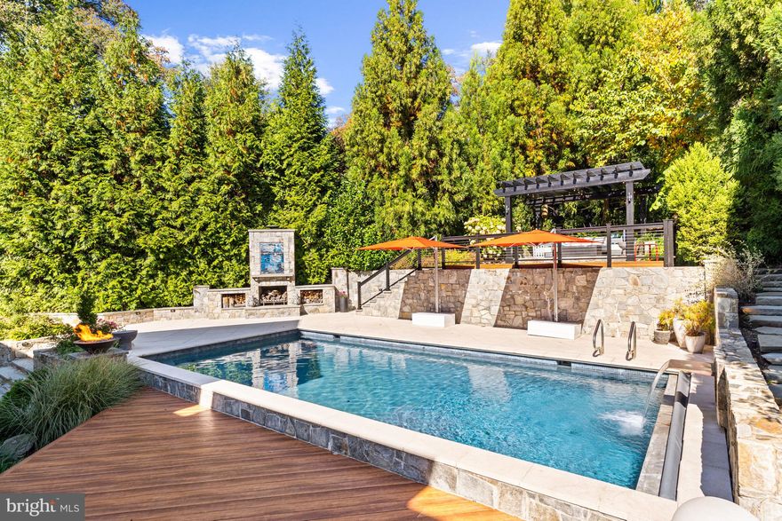 Nestled on a lush 0.38 acre lot in the exclusive Country Club Hills community, an unassuming contemporary Craftsman façade debuts a private urban oasis sure to take your breath away. Built in 2012 and continuously upgraded throughout the years, 4417 36th St N offers a jaw-dropping outdoor respite surpassing that of any luxury spa or high-end resort. Mature trees, stone retaining walls and eight-foot board on board fencing ensure utmost privacy for residents as they unwind in the heated 33’ saltwater pool, prepare an extravagant spread with the Lynx built-in grill, dine on the thermal stone flagstone dining terrace, or recline under the Zuri lounge deck’s pergola overlooking the enchanting oasis. Inside, 9,200 square feet of impeccably maintained and luxuriously updated interiors span the suburban sanctuary’s 3 methodically appointed levels. Showcasing incredible scale throughout, this 6 Bedroom, 5 Full Bathroom, 3 Half Bathroom residence displays exquisite design notes to include soaring 10-foot coffered and tray ceilings, elegant moldings, gleaming hardwood floors, top-of-the-line fixtures, luxury finishes and an abundance of windows flooding the expansive interiors with natural light. Debuting the rarely attainable and highly sought-after synthesis of modern amenities, timeless design, suburban serenity and urban convenience, this contemporary craftsman is an extraordinary gem sited in a priceless location. 
<br>
<br>
Offering a grand entrance, the two-story foyer lends a warm welcome to this exceptional abode. The vast yet intimate Living and Dining Rooms flank the palatial entryway to offer more formal settings for entertaining while the true heart of the home resides in the sprawling Family Room and coveted Chef’s Kitchen. Adorned with soaring coffered ceilings, walls of sliding glass doors and a cozy natural gas fireplace, the Family Room lends the quintessential space for charmingly intimate gatherings. Adjoint, the swoon-worthy Gourmet Kitchen is sure to delight any caliber chef. Boasting high-end Miele appliances, custom metal range hood, an in-wall coffee maker, herringbone tile backsplash, sleek cabinetry, ample counterspace, and a Butler’s Pantry with Bar Display, this state-of-the-art Kitchen is any host’s dream. Offering the pinnacle of indoor-outdoor living, numerous sliding glass doors lend direct access to the rear oasis for effortless al fresco dining and entertaining. Delight in a seamless transition from poolside lounging to evening enjoyment with the exterior’s Enhanced Lighting LLC Outdoor Lighting System and Speakers. A Home Office with lots of sunlight and convenient access and views of the rear patio, Mud Room with access to the newly transformed 2-Car Attached Garage completes the Main Level’s offerings. 
<br>
<br>
Comprised of the principal bedrooms, the Upper Level showcases an enviable Primary Suite sure to provide the ultimate sanctuary within the residence. Boasting 10’ tray ceilings, two separate entrances, a Sitting Room, two outfitted Walk-In Closets, and a fully renovated spa Bathroom featuring a dual vanity, soaking tub, and walk-in steam shower. Four bedrooms, 3 full bathrooms, a conveniently appointed Laundry Room with new tile flooring and new Electrolux Washer and Dryer, and additional Sitting Room are located on the Upper Level.
<br>
<br>
The multifunctional Lower Level has been completely transformed into a recreational masterpiece. Boasting a concrete pool table, aluminum tile gas fireplace, surround sound ceiling system, Stickwood wall system, Wine Room and Kitchenette with U-line Refrigerator, U-line Icemaker, Bosch Dishwasher, microwave, and ample seating, this Recreation Room is sure to impress and entertain guests or residents of any age. A home Gym with rubber flooring and sound system, additional ensuite Bedroom and ample storage space complete the Lower Level’s amenities.