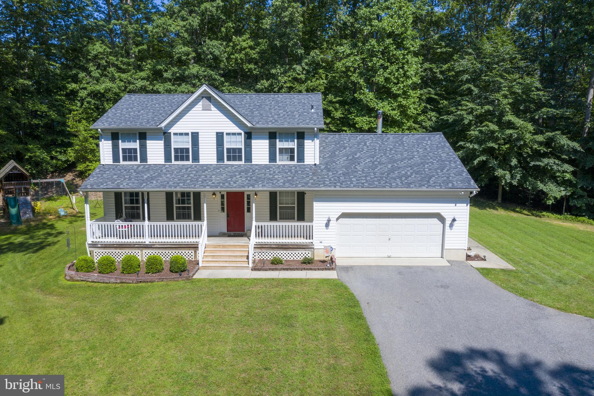 Come home to your private large 2 story colonial getaway in Brandywine!!! You will love this house the minute you pull in the driveway. Disconnect from the world and enjoy your 2.93 acres of private wooded land, or invite your friends and family over and entertain them on your large deck while having a cookout. This house features 4 bedrooms, 2.5 bathrooms, wood floors, stainless steal appliances, a wood stove for those winter nights, a large deck, covered front porch, 2 car garage with extra storage, and so much more!!! Come see this house today!