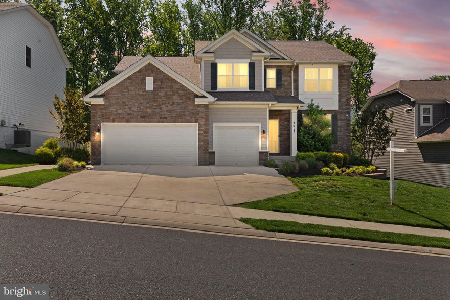 Welcome to 2412 Monarch Way, an exceptional residence nestled in the highly desirable Monarch Glen. Originally the community's prized model home, this impressively upgraded Jamestown model boasts 4,556 total square feet and features a rare, oversized three-car garage.

Step inside to discover an expansive open layout where luxury and comfort blend seamlessly together. A true chef's kitchen awaits, featuring sleek quartz countertops, stylish cabinetry with an abundance of storage with a convenient pantry and bar area. This culinary haven, equipped with the highest level of finishes, is perfect for both creating gourmet meals and hosting memorable social gatherings. The elegant formal dining room and open, airy foyer are enhanced by thoughtfully placed custom accent walls, adding a touch of modern sophistication.

Bathed in natural light, the kitchen truly serves as the heart of the home, showcasing a welcoming oversized island. The comfortable great room provides an ideal space for relaxation, while the adjacent deck invites you to enjoy the tranquility of the outdoors. The main level also offers a versatile bedroom and full bath, perfect for accommodating guests or creating a private home office. The large entryway from the garage offers added convenience with a walk-in closet and a practical drop-zone area.

Ascend to the upper level to find an additional living room, providing even more flexible living space, along with four more well-appointed bedrooms. The primary suite is a true sanctuary, complete with two spacious walk-in closets and a luxurious large en-suite bathroom with separate soaking tub and shower.

The finished basement recreation room offers a fantastic space for entertainment and leisure, with a conversation area and 3 other flex spaces. This amazing homesite backs to woods in the rear yard, offering a serene and secluded setting.

As the original model home, 2412 Monarch Way is brimming with high-end upgrades throughout. Offering an enviable location and designed for modern living with exceptional features and a wealth of upgrades, Do not miss your chance to experience the very best of this sought-after area.