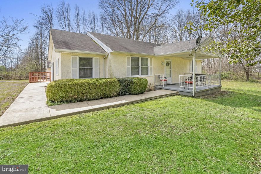 UPDATE - OFFER DEADLINE OF MONDAY 4/3 at 12pm. Fantastic opportunity to own a sweet non-development ranch on a 1.2 total acre lot with .82 acres in Maryland and .38 acres in Delaware.  2BR and 1BA with an office, full basement, large deck and oversized detached 2 car garage make this a great buy for the first time buyer or the downsizer seeking privacy and a good sized lot in a convenient location.  True one floor living as laundry is on the main floor in a closet at one end of the kitchen.  Beautiful lot has trees to the west and south and backs to a large picturesque cattle farm.  Septic system was installed in 2009, and meticulously maintained with all reports and records provided.  Stucco exterior appears to need remediation.  Property is being sold as-is to settle an estate and is priced accordingly.  .38 of the total 1.2 acres is in Delaware - tax parcel number 11-060.00-004, $25 total property tax is paid to Delaware yearly and is included in the total amount for property tax in property description.