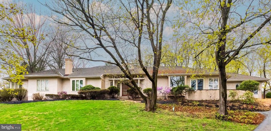 Welcome to 1215 Youngs Road, nestled in the highly desirable West Chester Area School District. This one of a kind home in Charter Chase offers 5 bedrooms and 4.5 bathrooms, all within a thoughtfully designed single-story layout. Upon entering, you're greeted by a stunning open-concept family and dining room with soaring ceilings and sliding glass doors that lead to the expansive back patio—perfect for seamless indoor-outdoor living. To the right, a gorgeous modern kitchen awaits, complete with Siematic cabinets, a breakfast nook, walk-in pantry, and a separate caterer's kitchen for effortless entertaining. French doors off the kitchen open to a front patio overlooking the neighborhood—an ideal spot to enjoy your morning coffee. Adjacent to the kitchen, the cozy living room features a charming brick fireplace, built-in shelving, and additional access to the rear patio. A powder room conveniently located off this wing completes the right side of the home. On the opposite side, the luxurious primary suite offers its own fireplace and ample space for a private sitting area. The en-suite bath includes a soaking tub, walk-in shower, and dual walk-in closets for maximum storage. Four additional generously sized bedrooms share two full bathrooms, while a spacious laundry room with extra storage and a utility sink completes the left wing. The finished basement offers incredible flexibility, complete with the home's fourth full bathroom—ideal for accommodating a home gym, media lounge, game room, or creative studio. Take advantage of the exceptional amenities offered by Charter Chase, including a swimming pool, tennis courts, clubhouse, and more. This versatile space enhances both comfort and functionality, making it a true extension of the living area. Ideally located near shopping, dining, and major commuter routes, this home offers the perfect blend of comfort, convenience, and character. Don't miss the opportunity to own this truly unique property and make it your own.